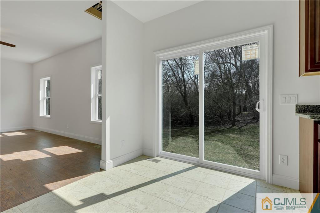 11 Addison Road Howell, NJ 07731 - Photo 12 of 25 a bedroom with a bed and large window