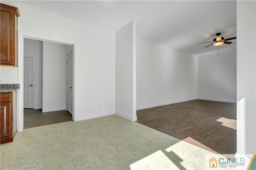 11 Addison Road Howell, NJ 07731 - Photo 13 of 25 an empty room with a bench