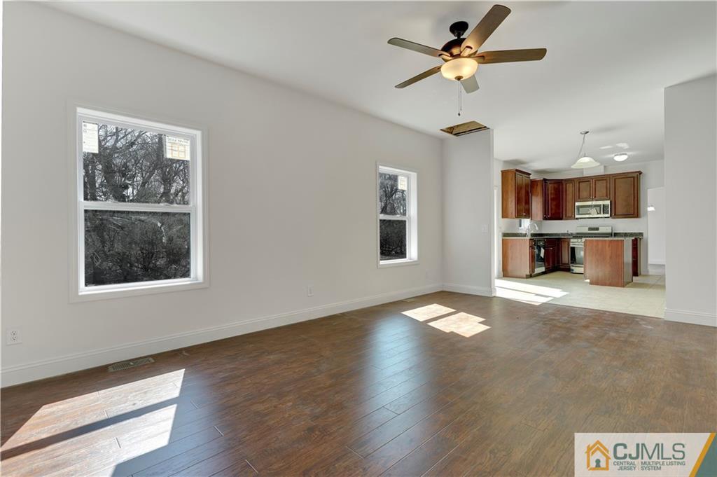 11 Addison Road Howell, NJ 07731 - Photo 14 of 25 a view of work space with wooden floor and a ceiling fan