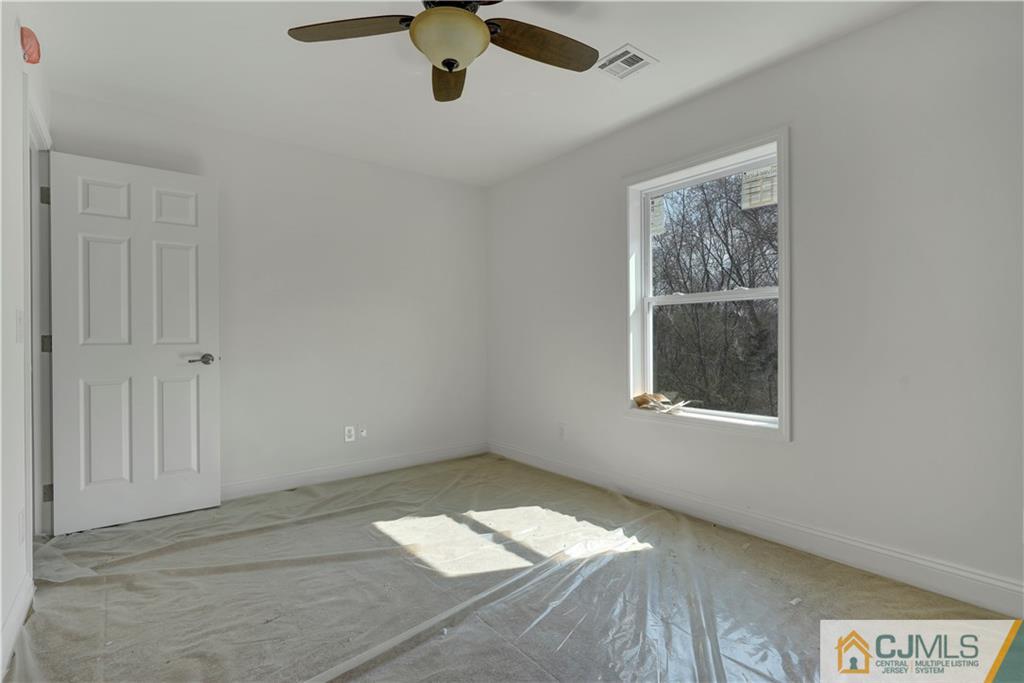 11 Addison Road Howell, NJ 07731 - Photo 20 of 25 a view of empty room with a window
