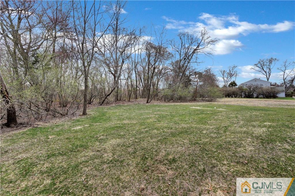 11 Addison Road Howell, NJ 07731 - Photo 25 of 25 a view of outdoor space with green field and trees