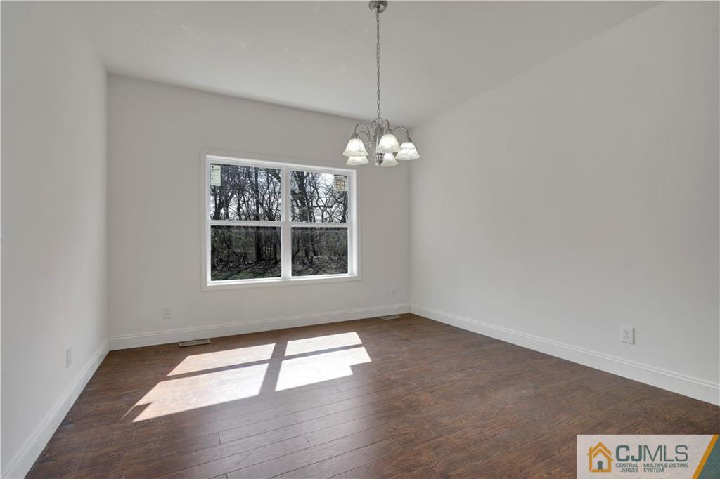 11 Addison Road Howell, NJ 07731 - Photo 6 of 25 a view of an empty room with a window