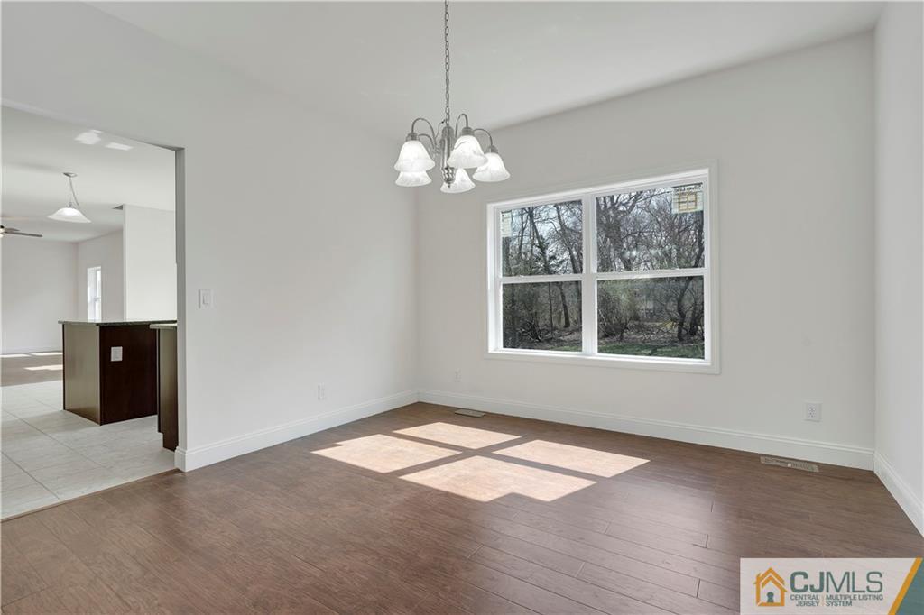11 Addison Road Howell, NJ 07731 - Photo 7 of 25 a view of an empty room with a window