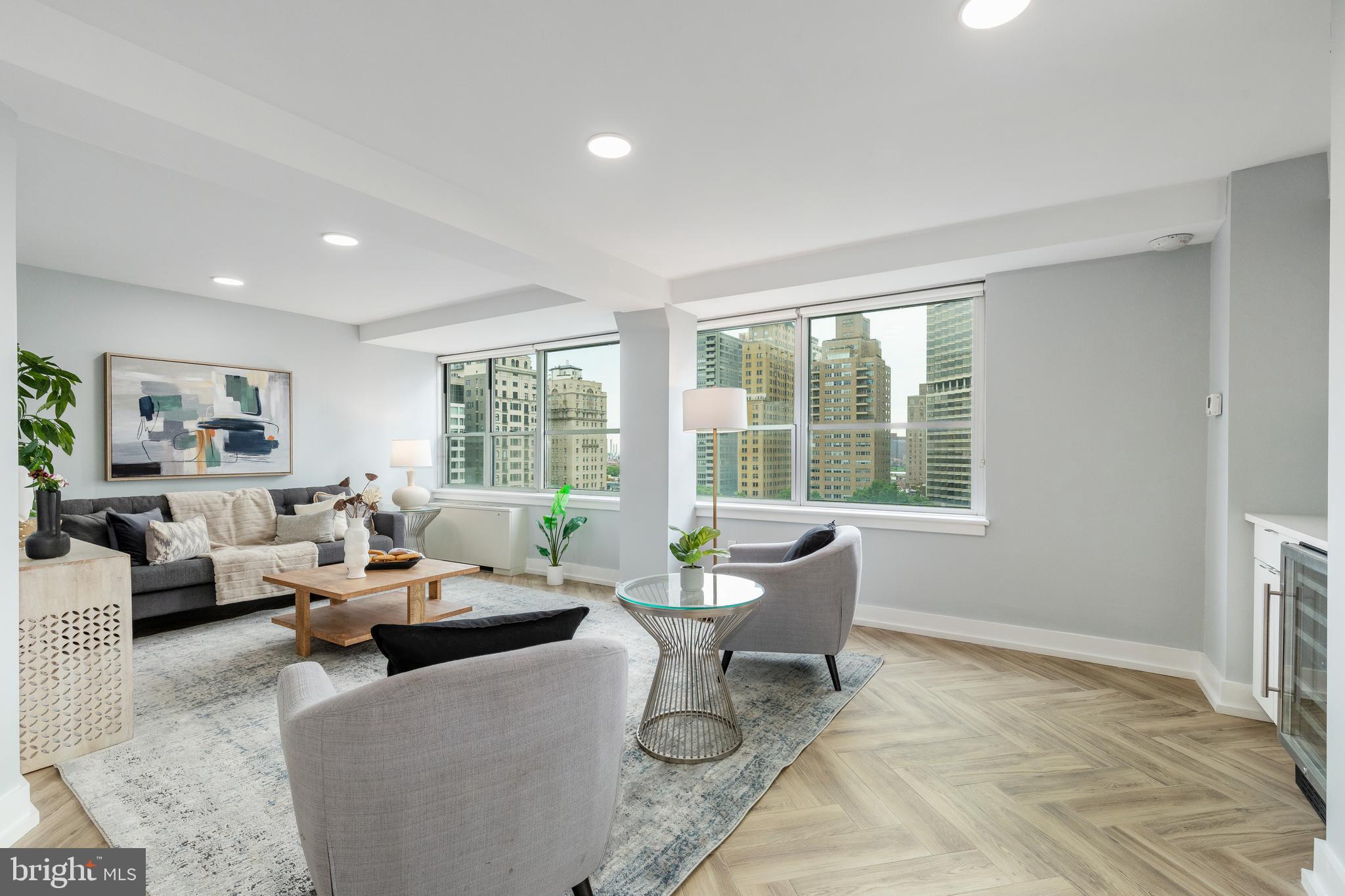 201 South 18th Street, Unit 1416 Philadelphia, PA 19103 - Photo 1 of 74 a living room with furniture and large windows