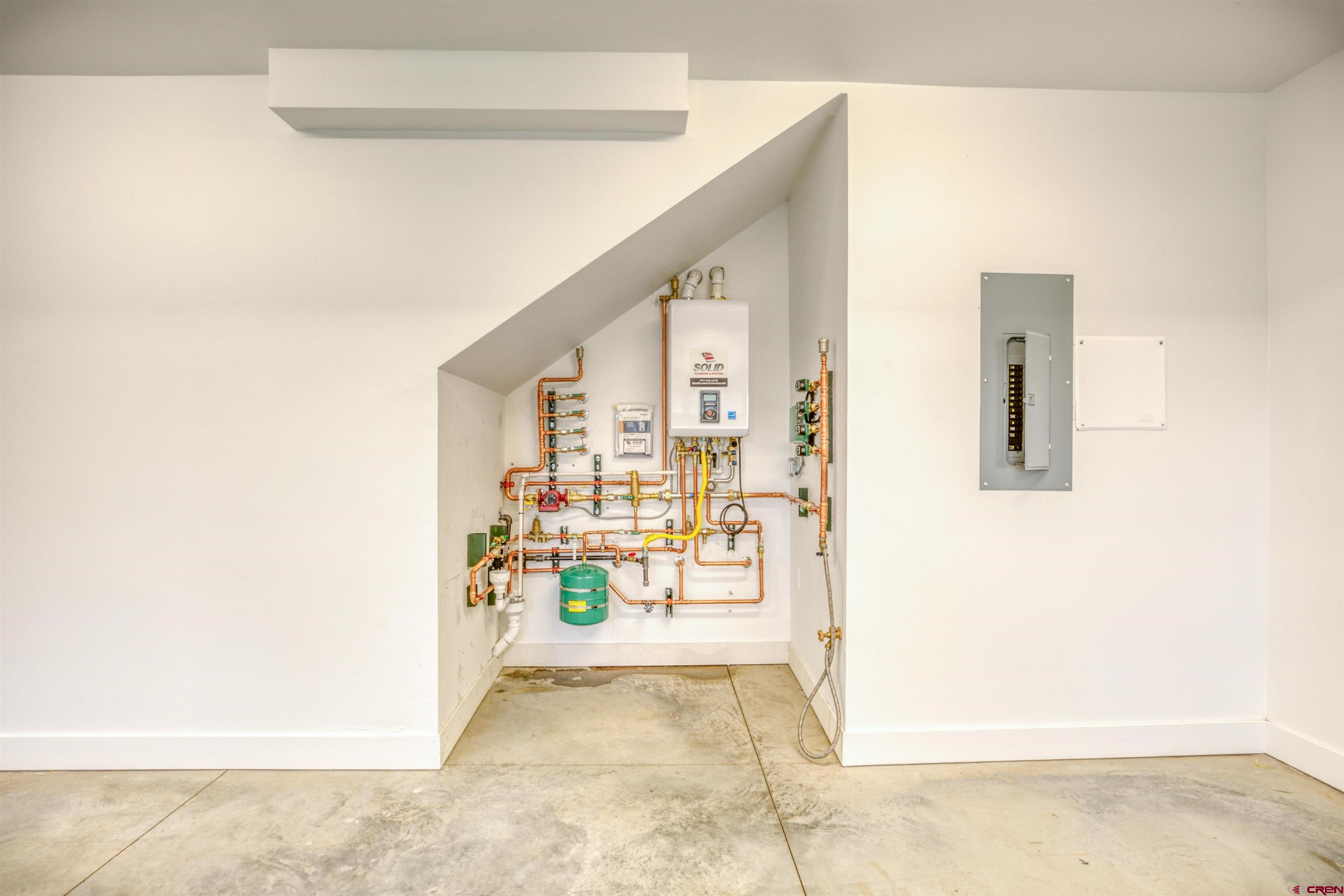2790 Rock Road, Unit B Pagosa Springs, CO 81147 - Photo 13 of 43 a view of a hallway with wooden floor and a room