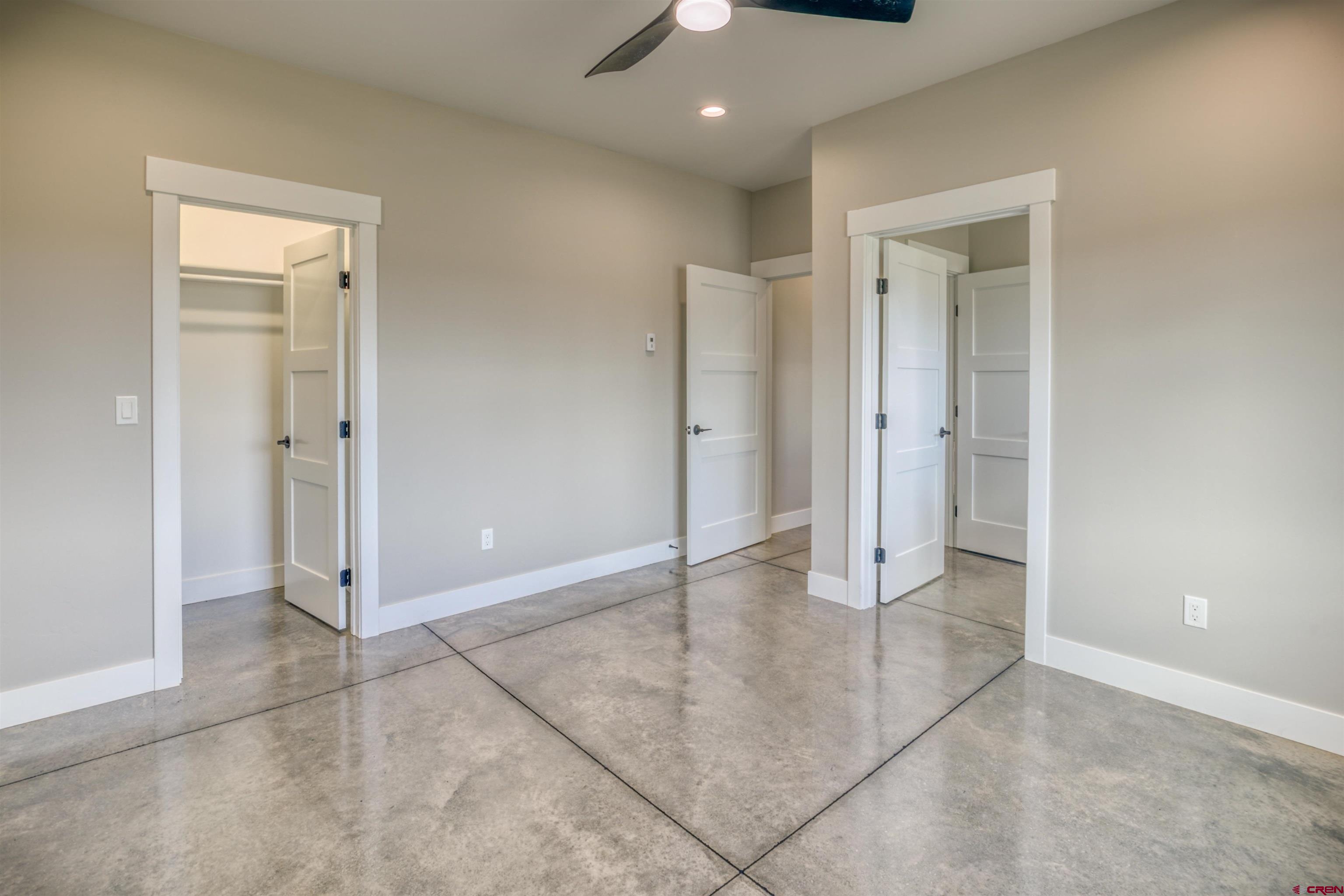 2790 Rock Road, Unit B Pagosa Springs, CO 81147 - Photo 18 of 43 an empty room with closet and a chandelier fan