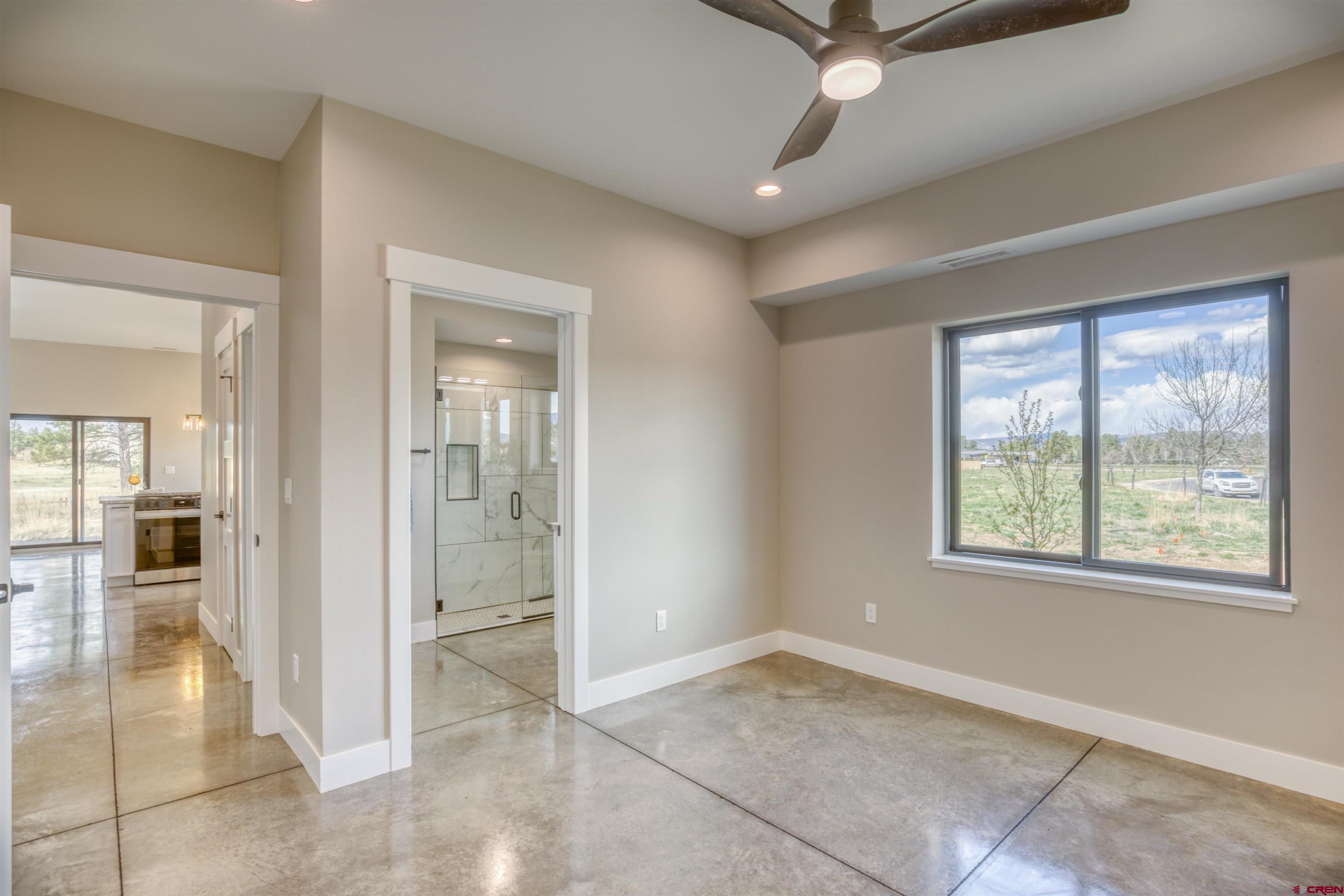 2790 Rock Road, Unit B Pagosa Springs, CO 81147 - Photo 20 of 43 wooden floor in an empty room with a window