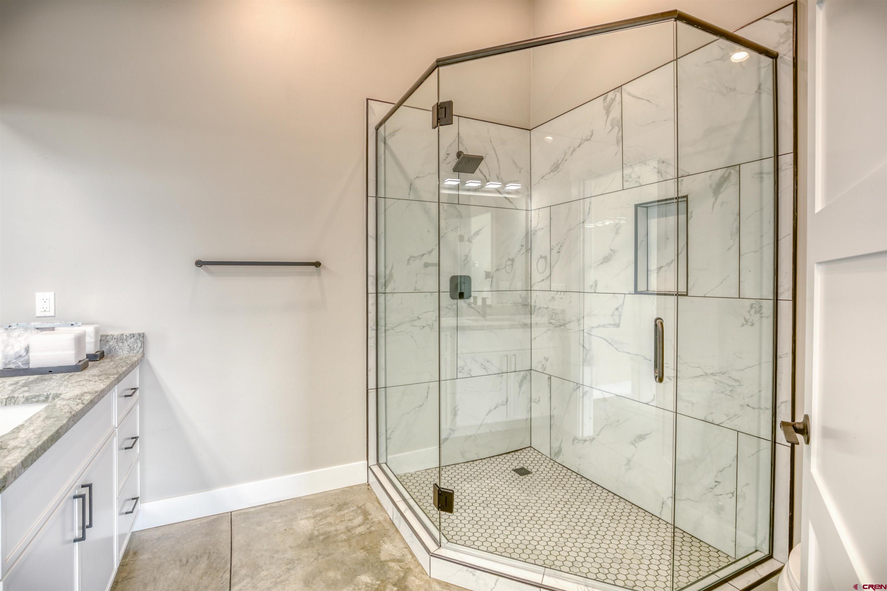 2790 Rock Road, Unit B Pagosa Springs, CO 81147 - Photo 25 of 43 a bathroom with a shower and a sink
