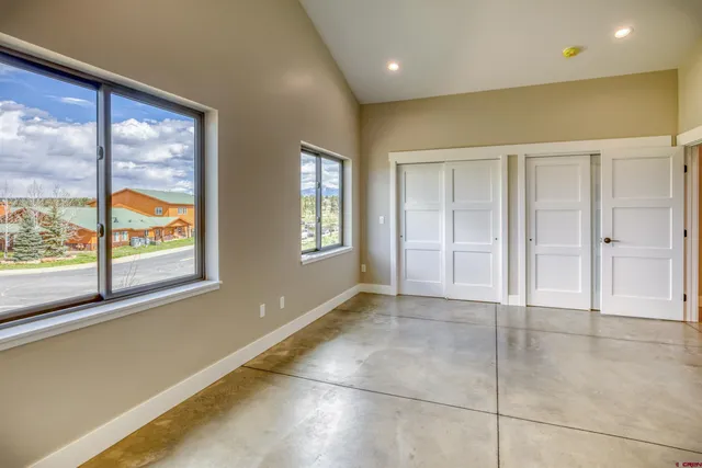 a view of an empty room with glass door