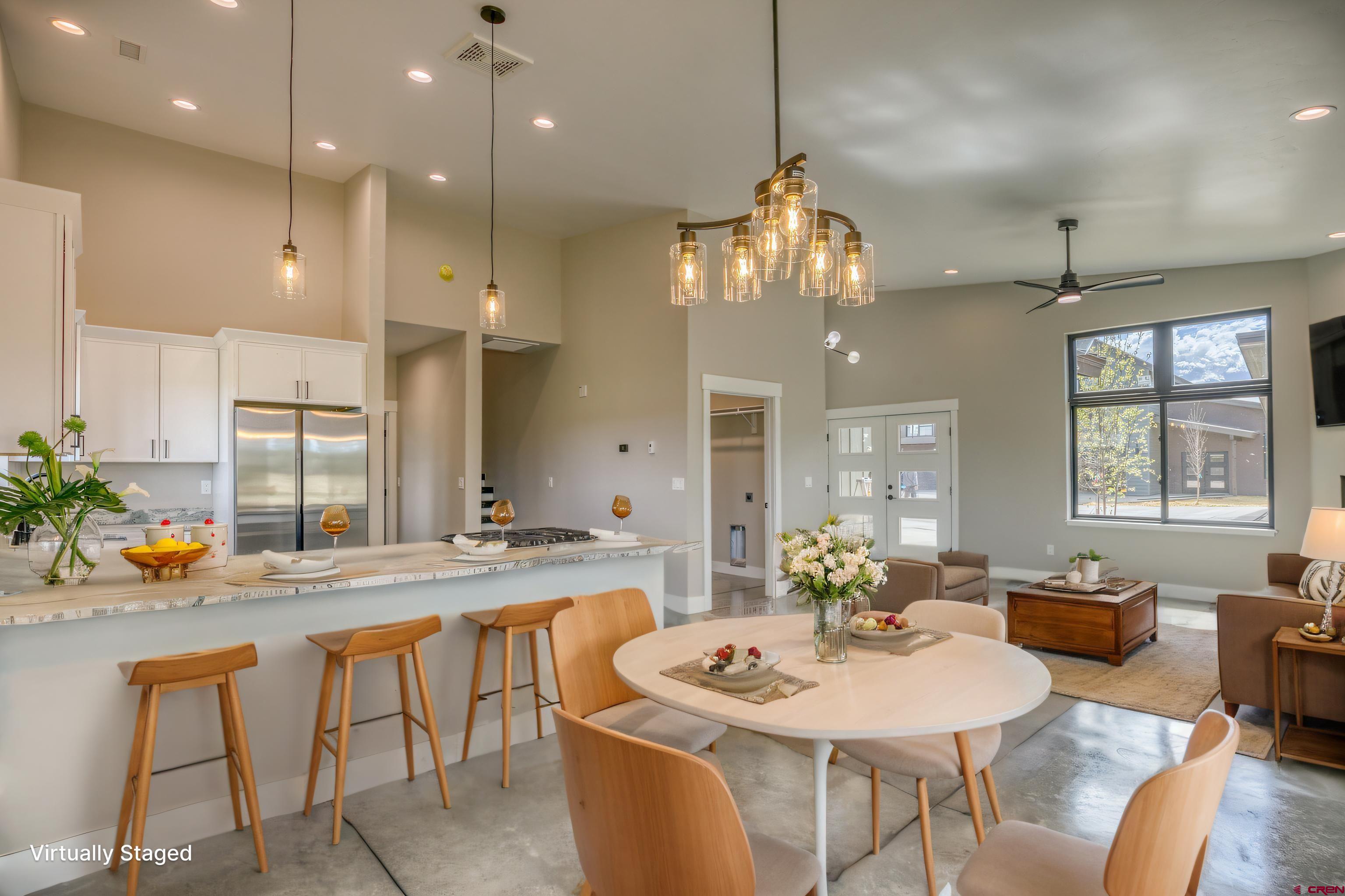 2790 Rock Road, Unit B Pagosa Springs, CO 81147 - Photo 36 of 43 a view of a dining room kitchen furniture and a chandelier