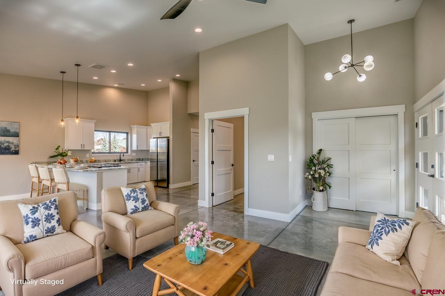 2790 Rock Road, Unit B Pagosa Springs, CO 81147 - Photo 39 of 43 a living room with furniture and a chandelier