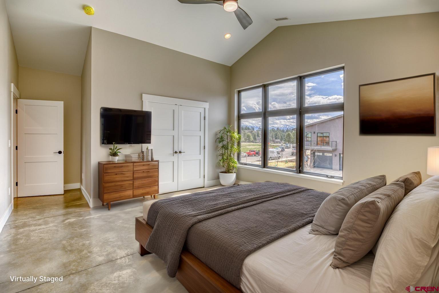 2790 Rock Road, Unit B Pagosa Springs, CO 81147 - Photo 41 of 43 a bedroom with a bed and a flat screen tv