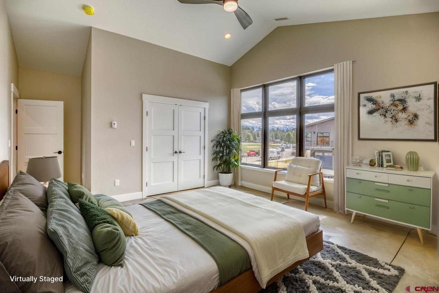 2790 Rock Road, Unit B Pagosa Springs, CO 81147 - Photo 42 of 43 a bedroom with a large bed and a couch