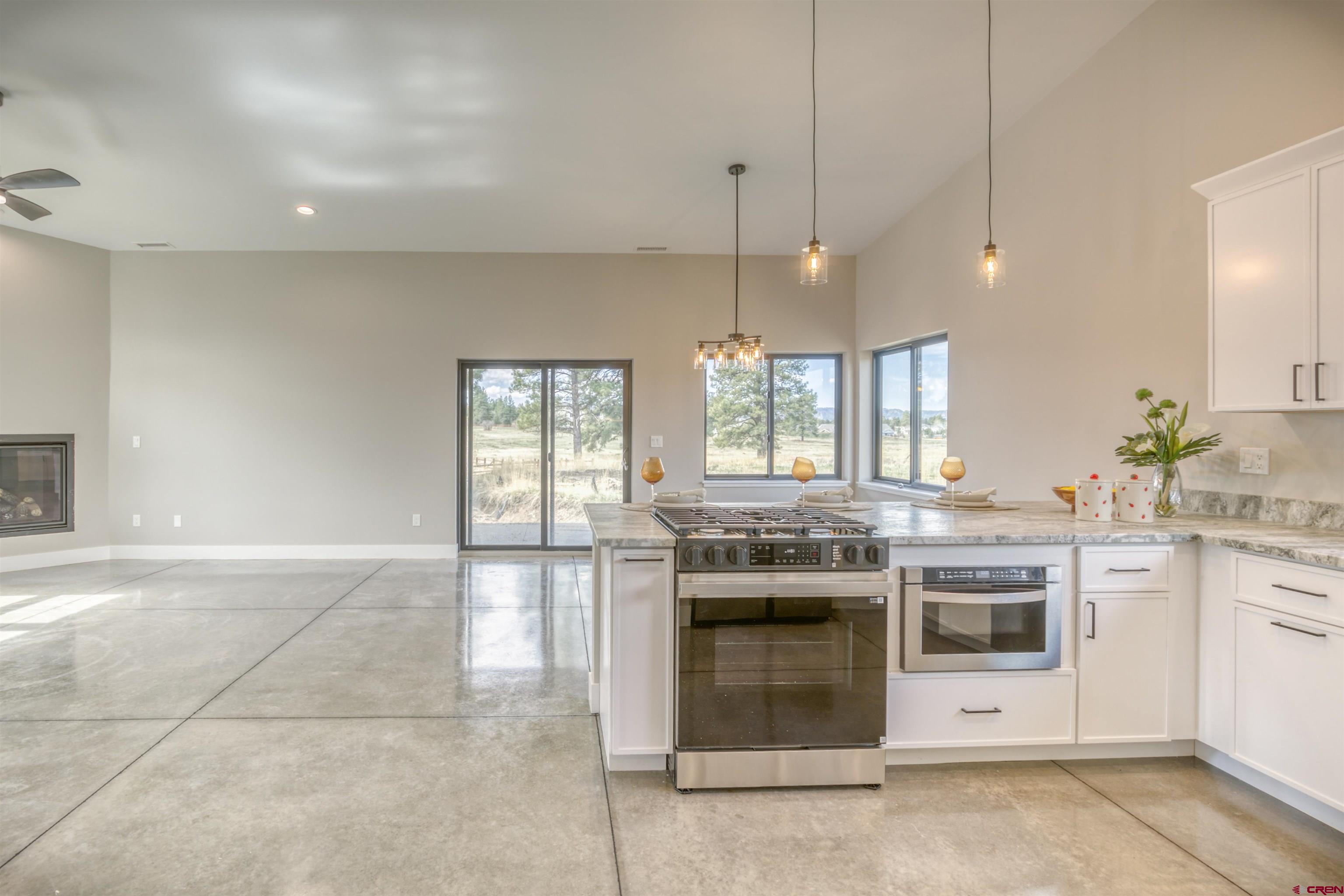 2790 Rock Road, Unit B Pagosa Springs, CO 81147 - Photo 8 of 43 a kitchen with a stove and a sink