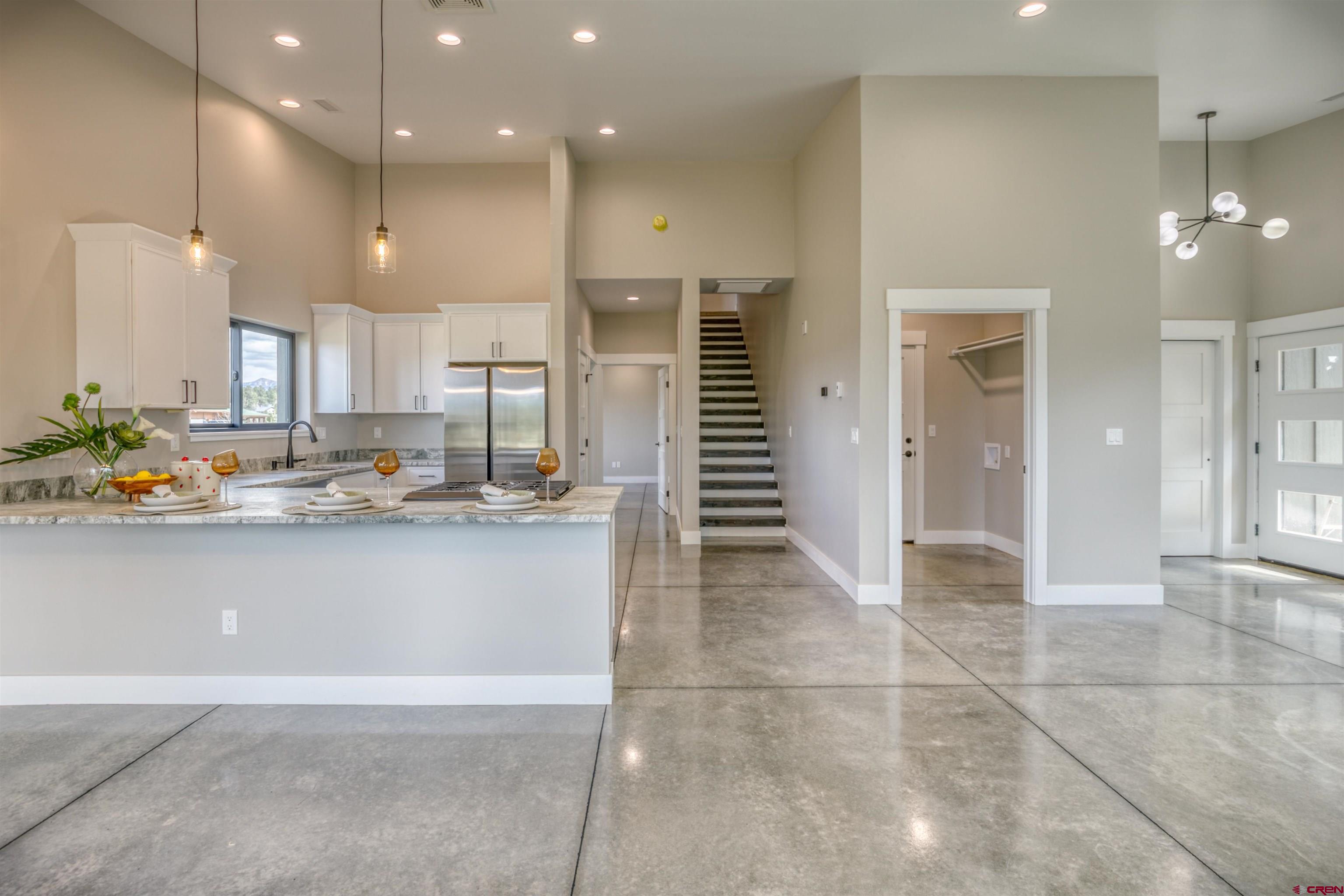 2790 Rock Road, Unit B Pagosa Springs, CO 81147 - Photo 10 of 43 a kitchen with stainless steel appliances granite countertop a refrigerator and a sink
