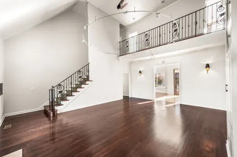 a view of an entryway with wooden floor