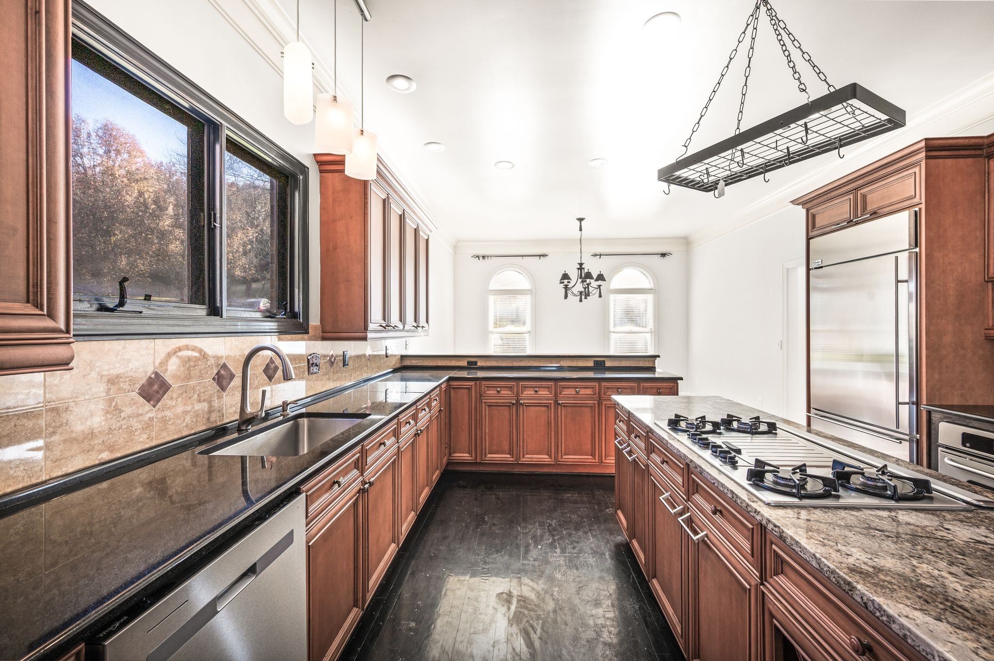 1060 Stonebridge Park Drive Franklin, TN 37069 - Photo 12 of 51 a kitchen with stainless steel appliances granite countertop a sink stove and refrigerator