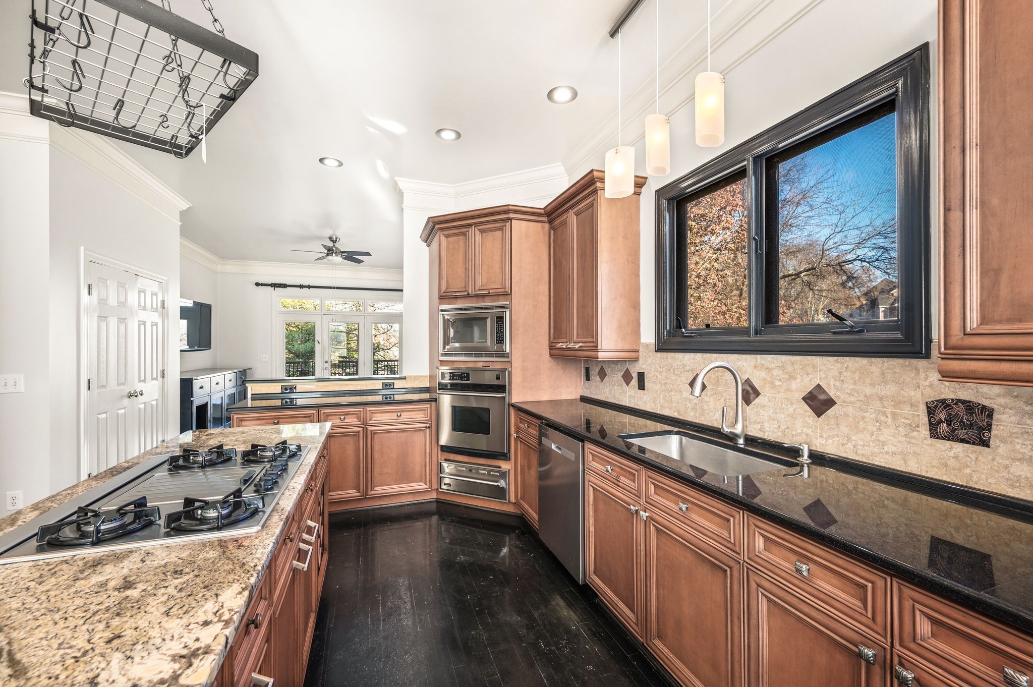 1060 Stonebridge Park Drive Franklin, TN 37069 - Photo 13 of 51 a kitchen with stainless steel appliances a stove sink and cabinets