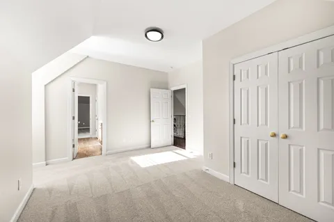 a bathroom with a sink mirror and toilet
