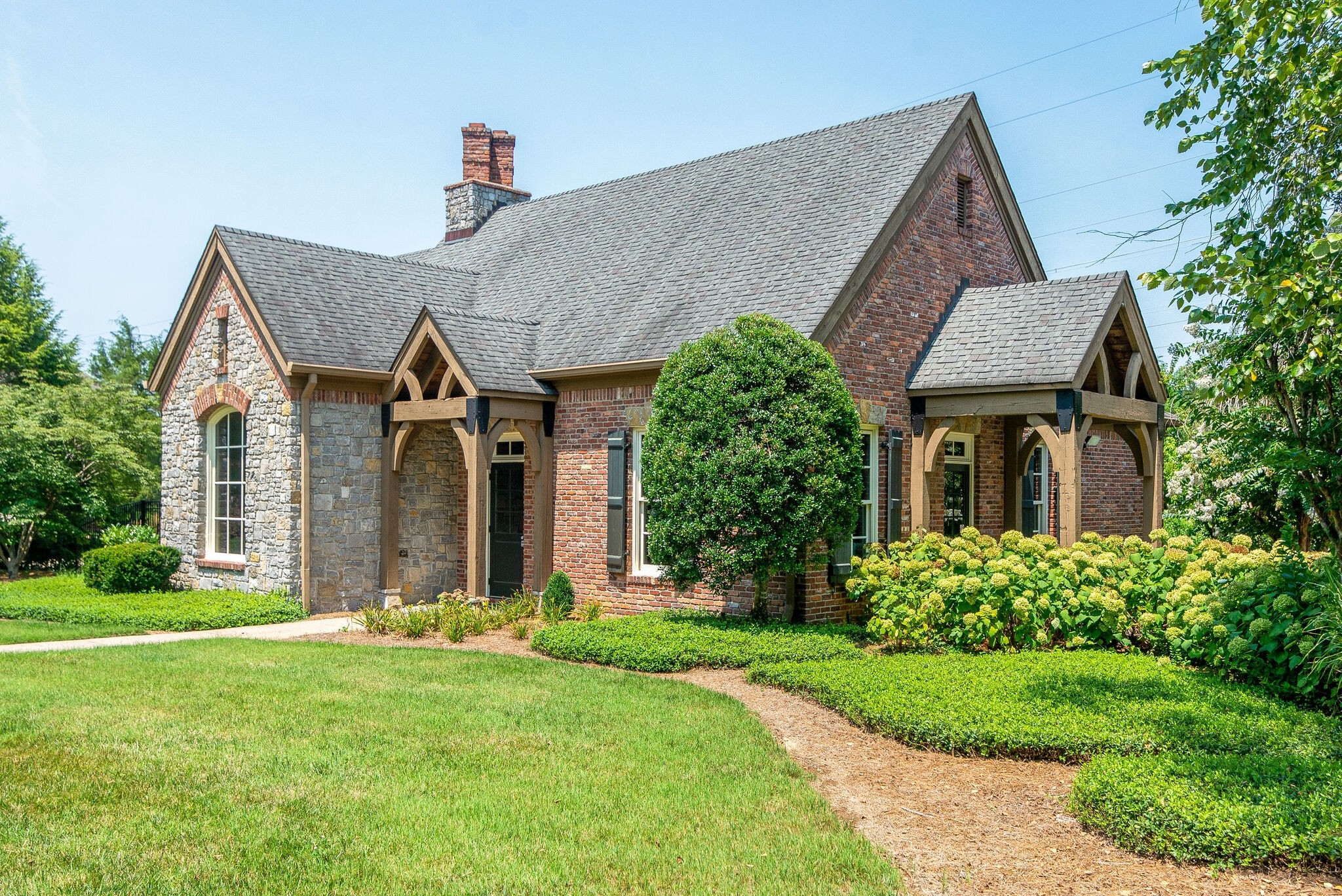 1060 Stonebridge Park Drive Franklin, TN 37069 - Photo 47 of 51 a front view of a house with garden