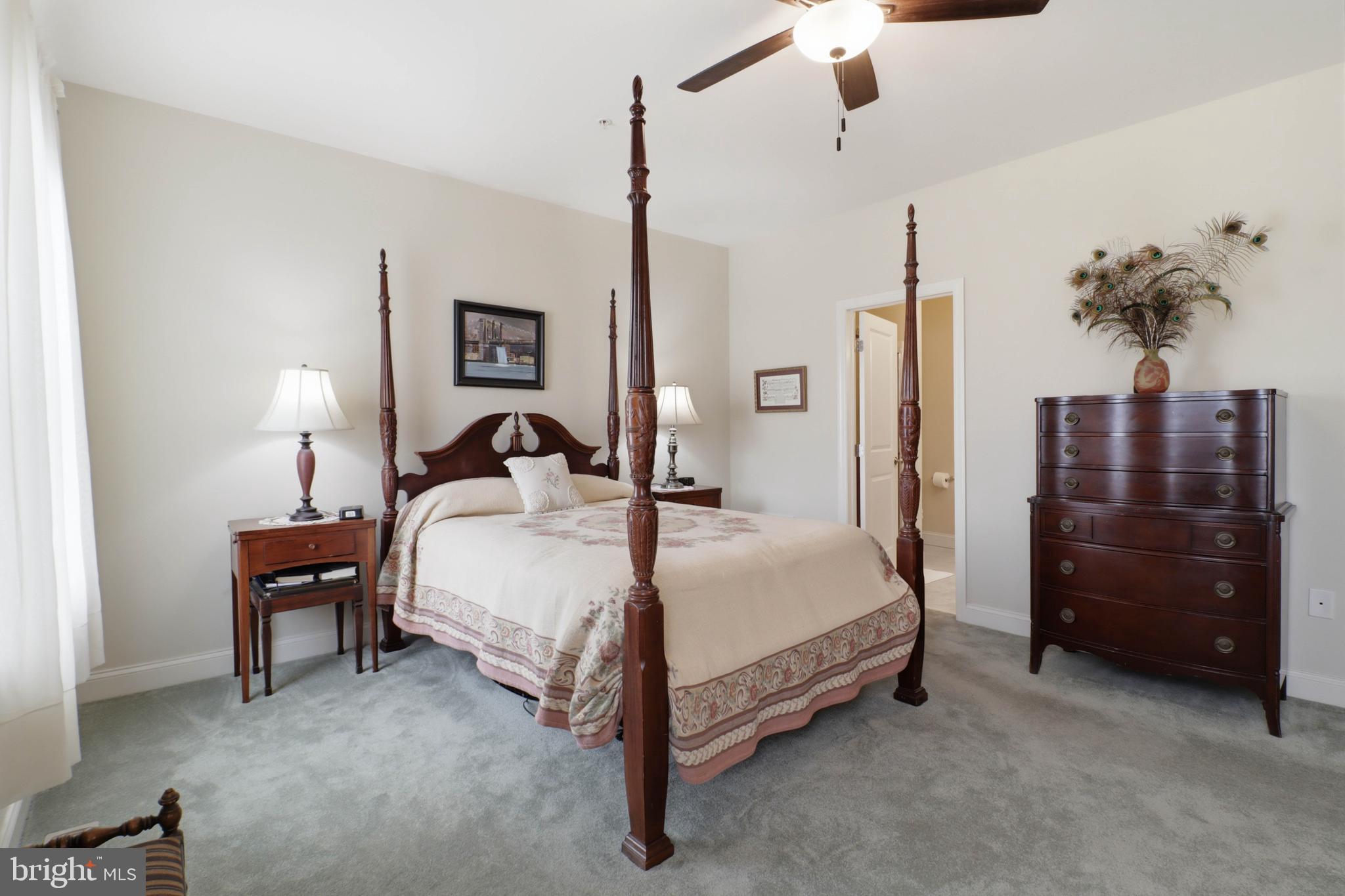 637 Lititz Reserve Lane Lititz, PA 17543 - Photo 11 of 31 a bedroom with a bed and a chandelier