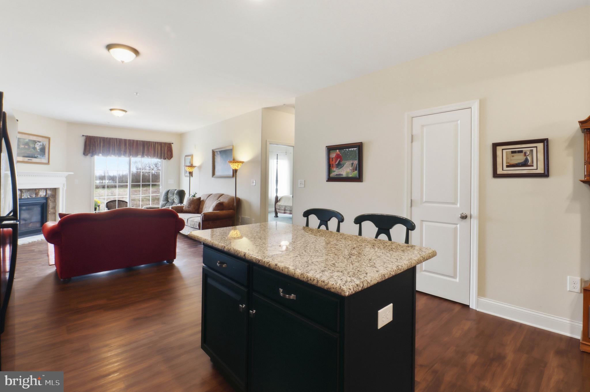 637 Lititz Reserve Lane Lititz, PA 17543 - Photo 3 of 31 a view of kitchen island a sink and living room