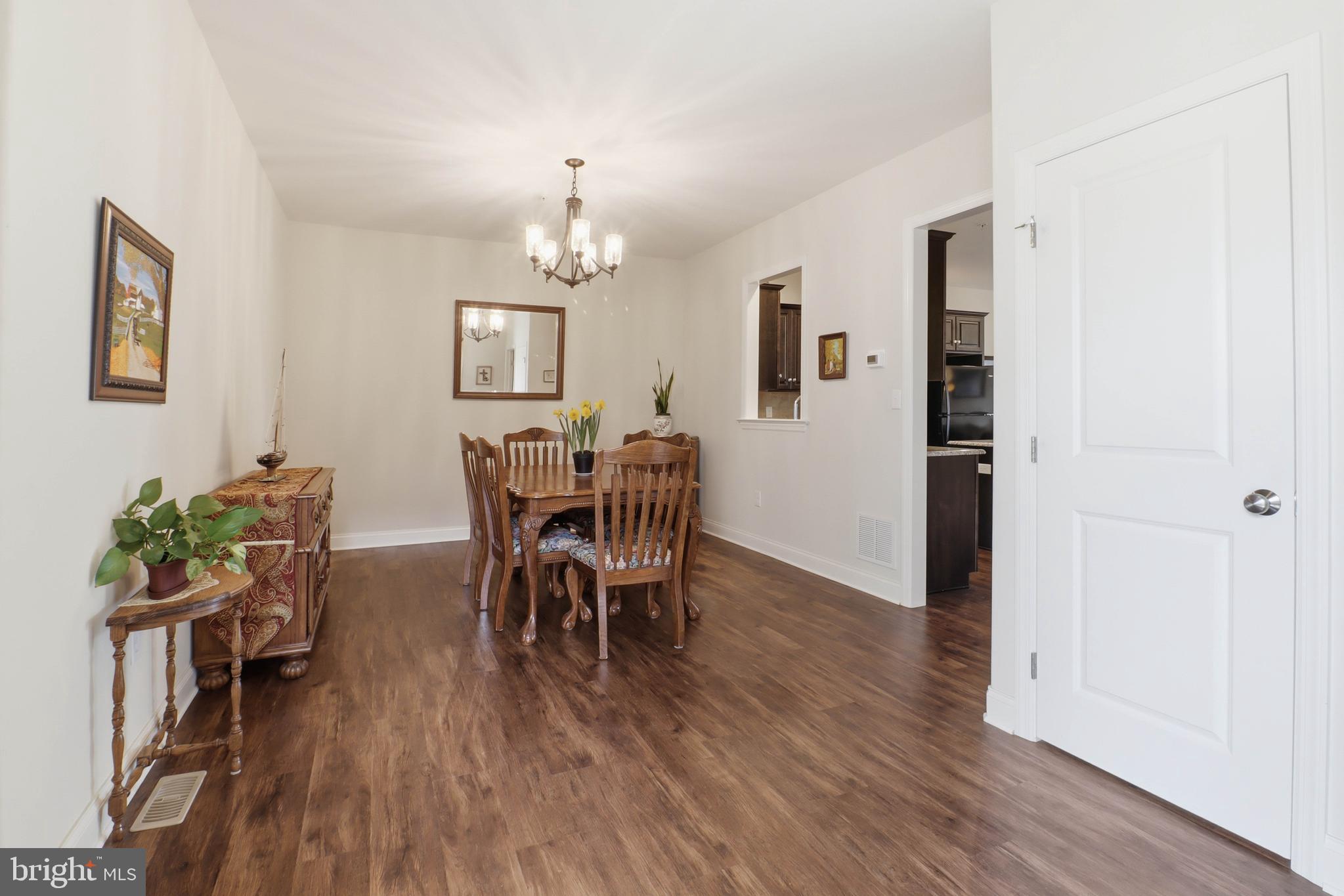637 Lititz Reserve Lane Lititz, PA 17543 - Photo 10 of 31 a view of a dining room with furniture and wooden floor