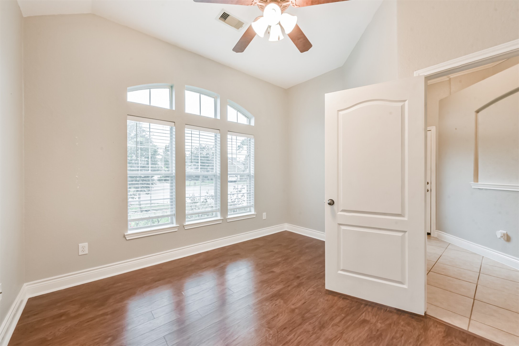 1065 Brigid Court Dickinson, TX 77539 - Photo 25 of 37 an empty room with wooden floor cabinet and windows