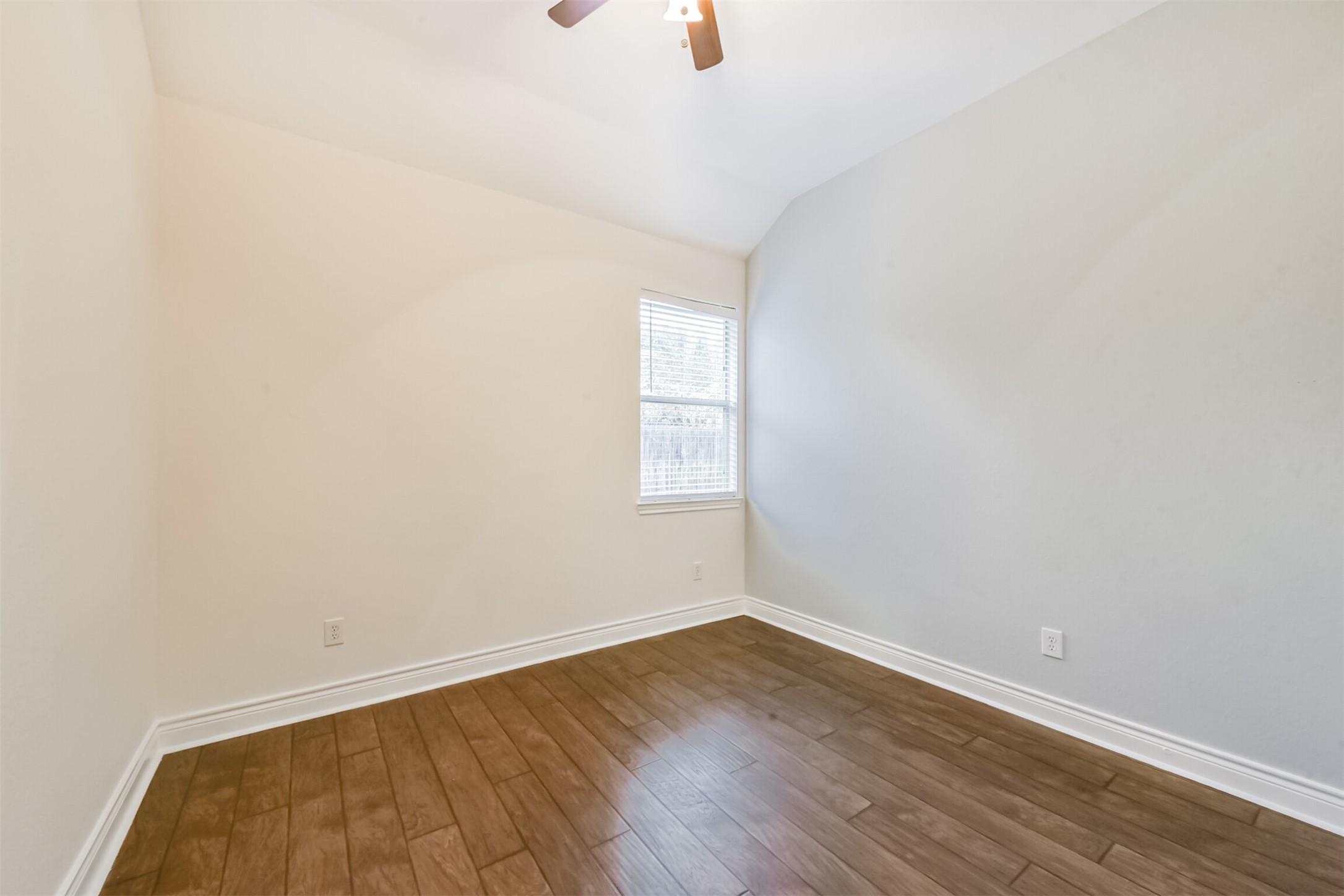 1065 Brigid Court Dickinson, TX 77539 - Photo 32 of 37 an empty room with wooden floor and windows