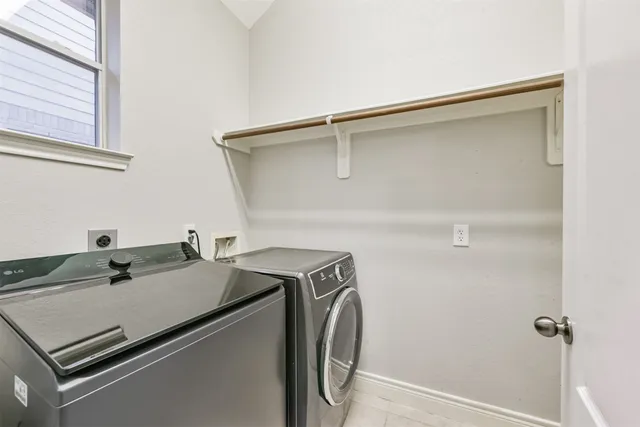 a utility room with dryer and washer