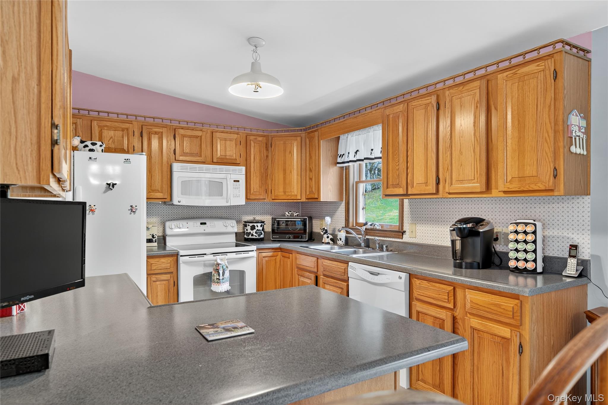 812 Obernberg Road North Branch, NY 12766 - Photo 18 of 43 a kitchen with kitchen island granite countertop a sink stove and cabinets