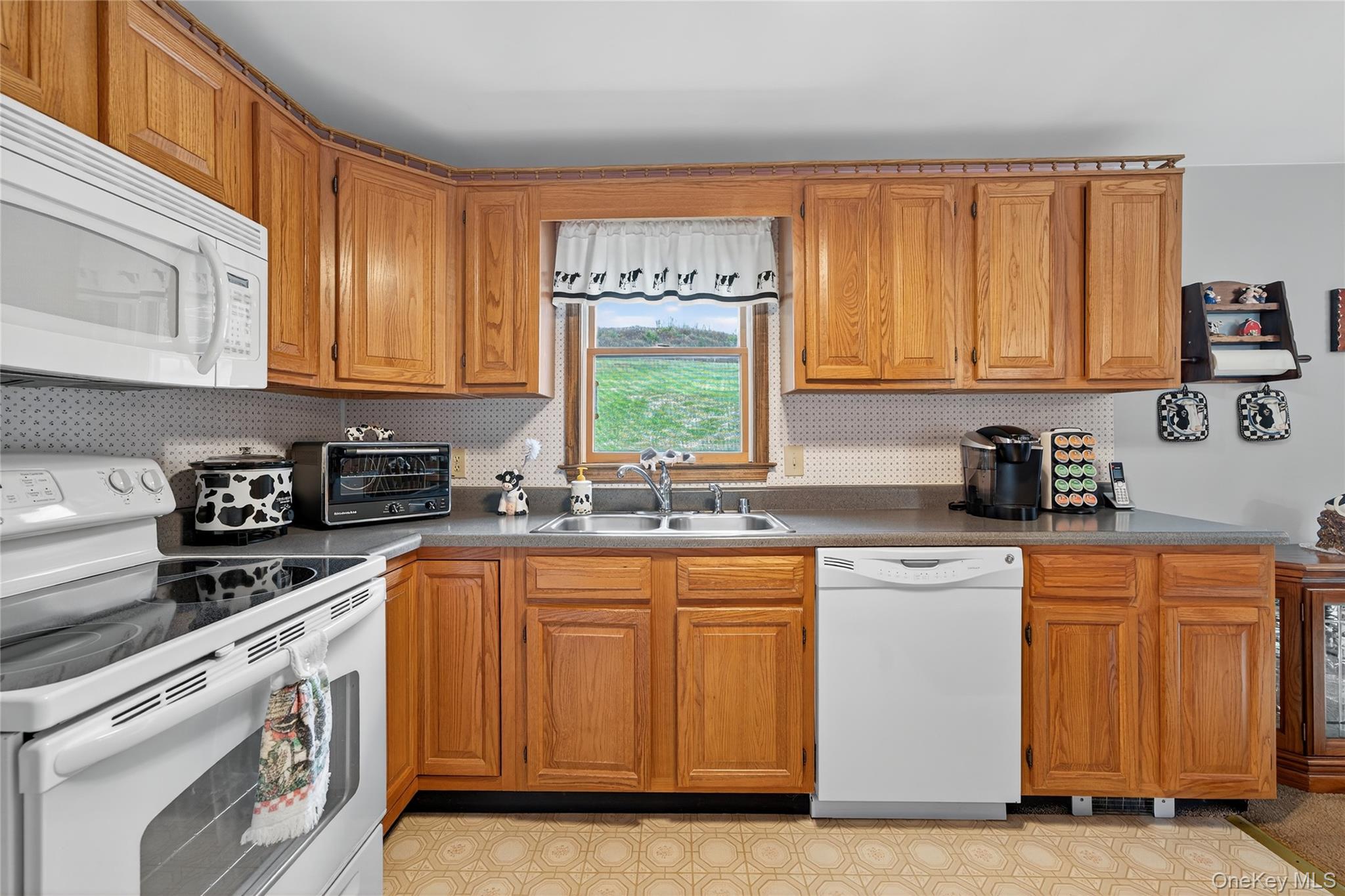 812 Obernberg Road North Branch, NY 12766 - Photo 19 of 43 a kitchen with stainless steel appliances granite countertop a stove a sink and white cabinets