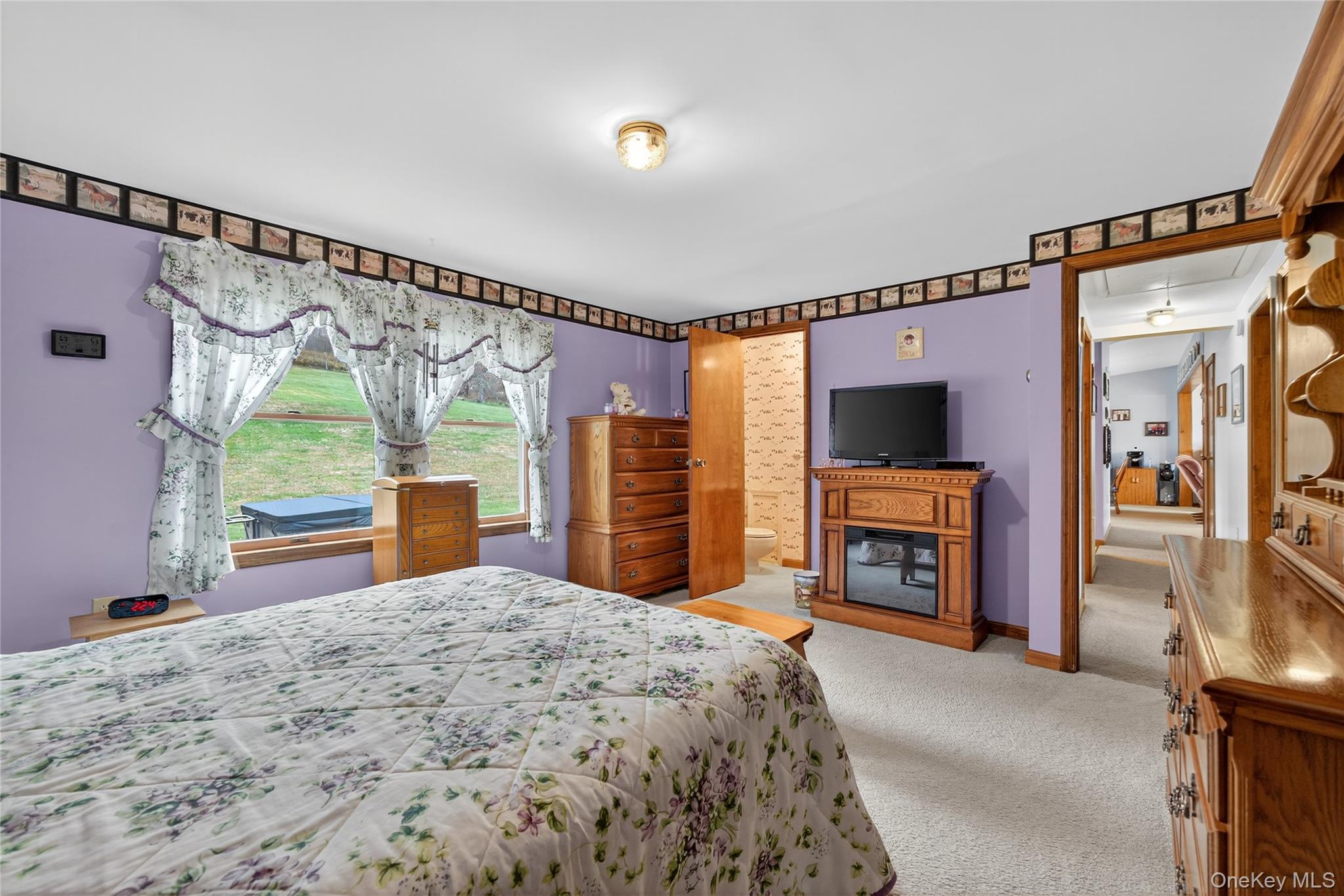 812 Obernberg Road North Branch, NY 12766 - Photo 23 of 43 a bedroom with a bed and a fireplace