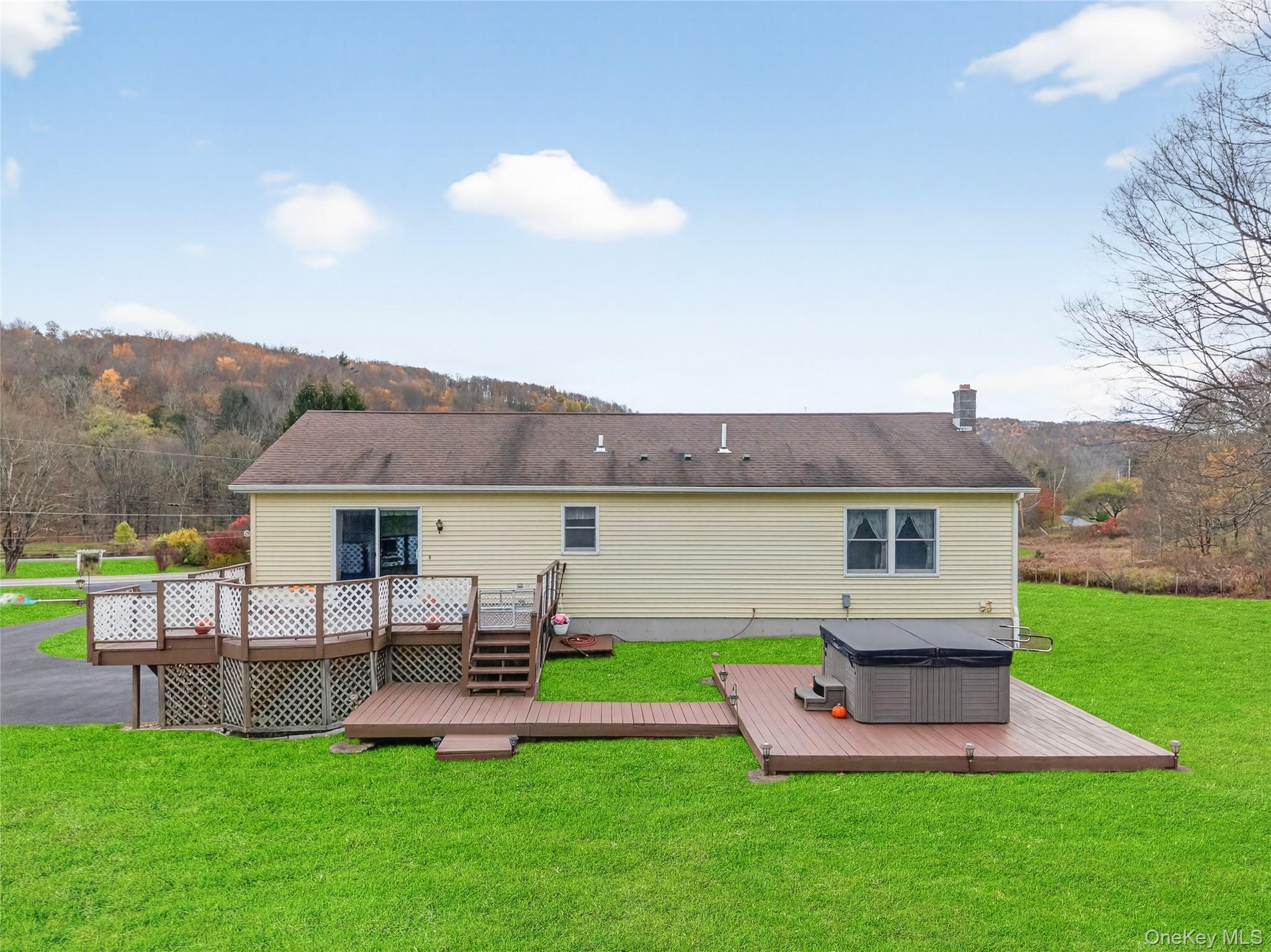 812 Obernberg Road North Branch, NY 12766 - Photo 35 of 43 a view of a house with a yard porch and sitting area