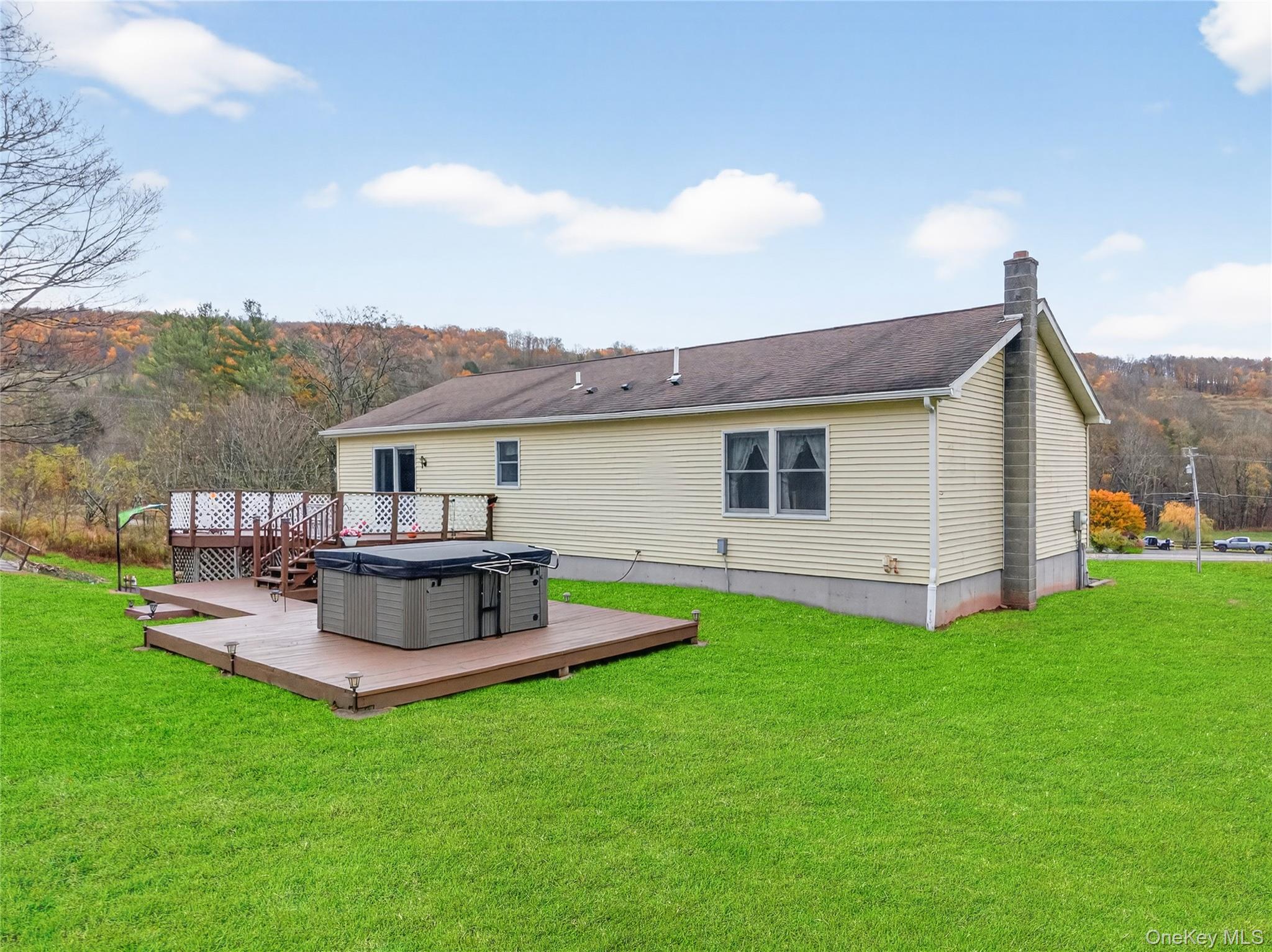 812 Obernberg Road North Branch, NY 12766 - Photo 36 of 43 a view of a house with a backyard and a patio