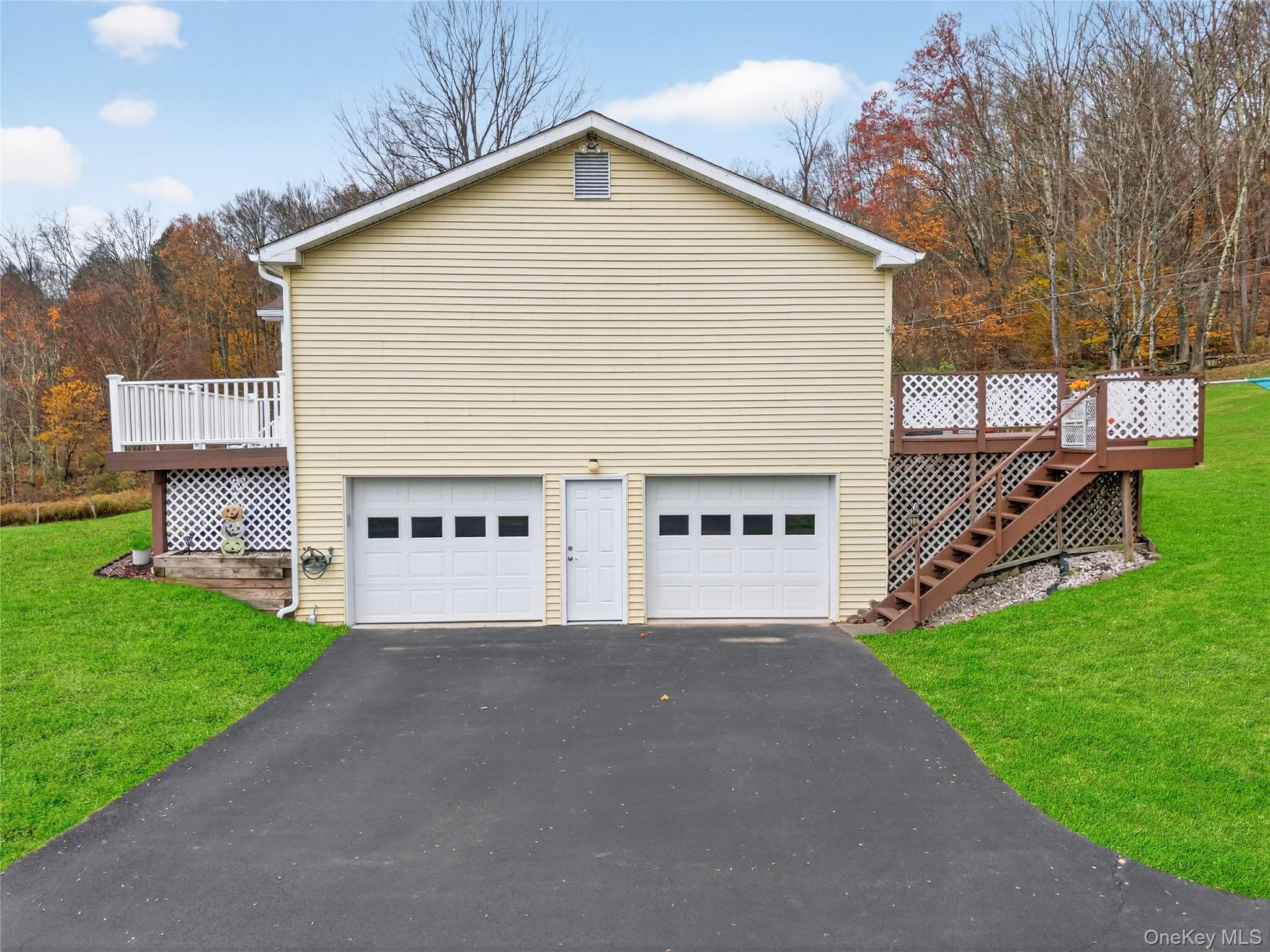 812 Obernberg Road North Branch, NY 12766 - Photo 37 of 43 a view of a house with a yard and a garage