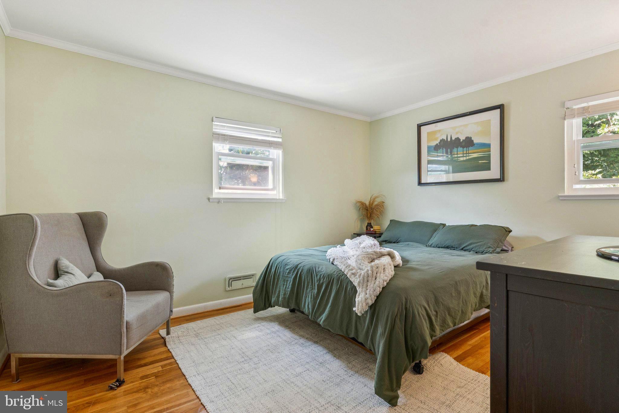 6200 Gilston Park Road Catonsville, MD 21228 - Photo 13 of 34 a bed room with a bed and chair