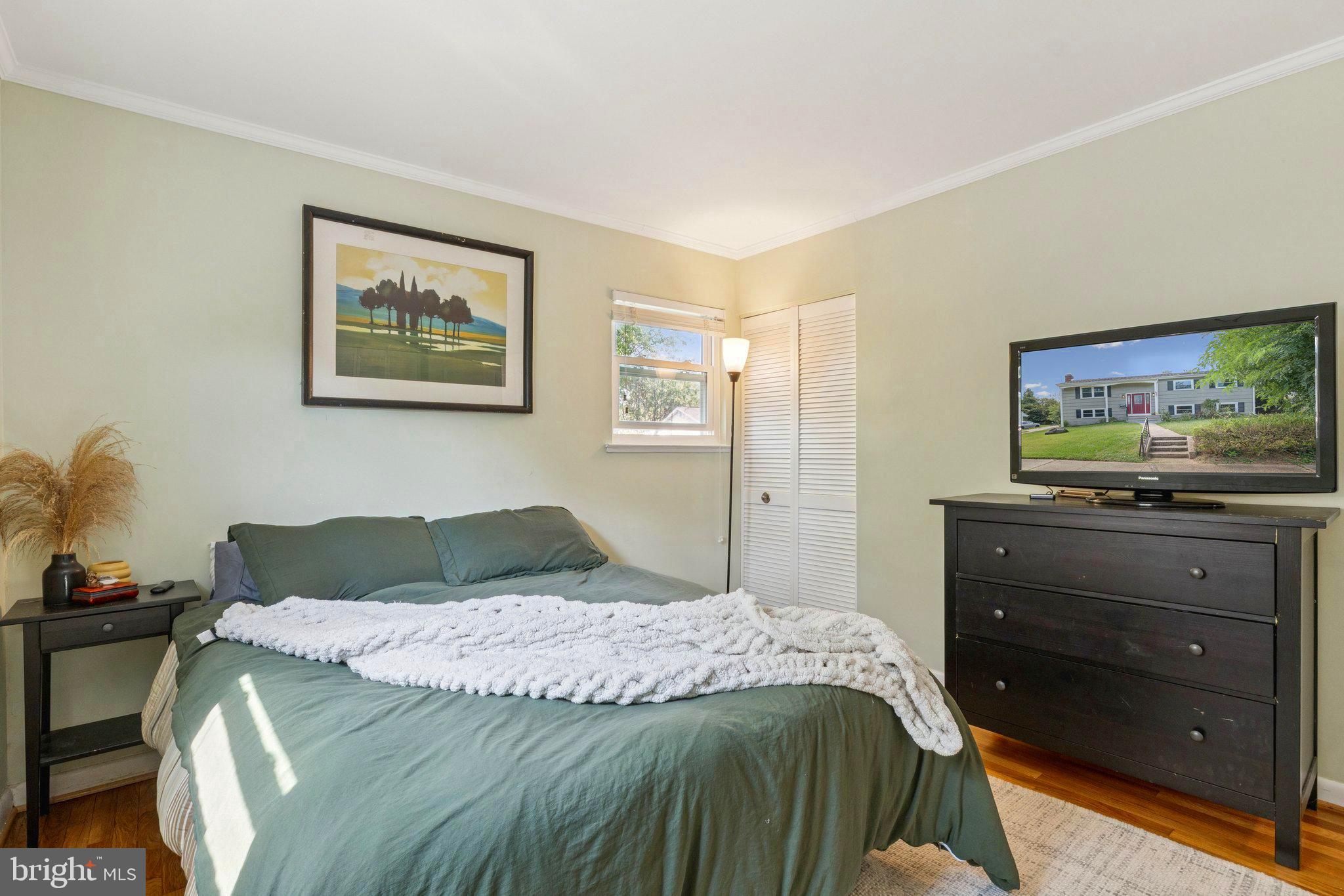 6200 Gilston Park Road Catonsville, MD 21228 - Photo 14 of 34 a bedroom with a bed and a flat screen tv