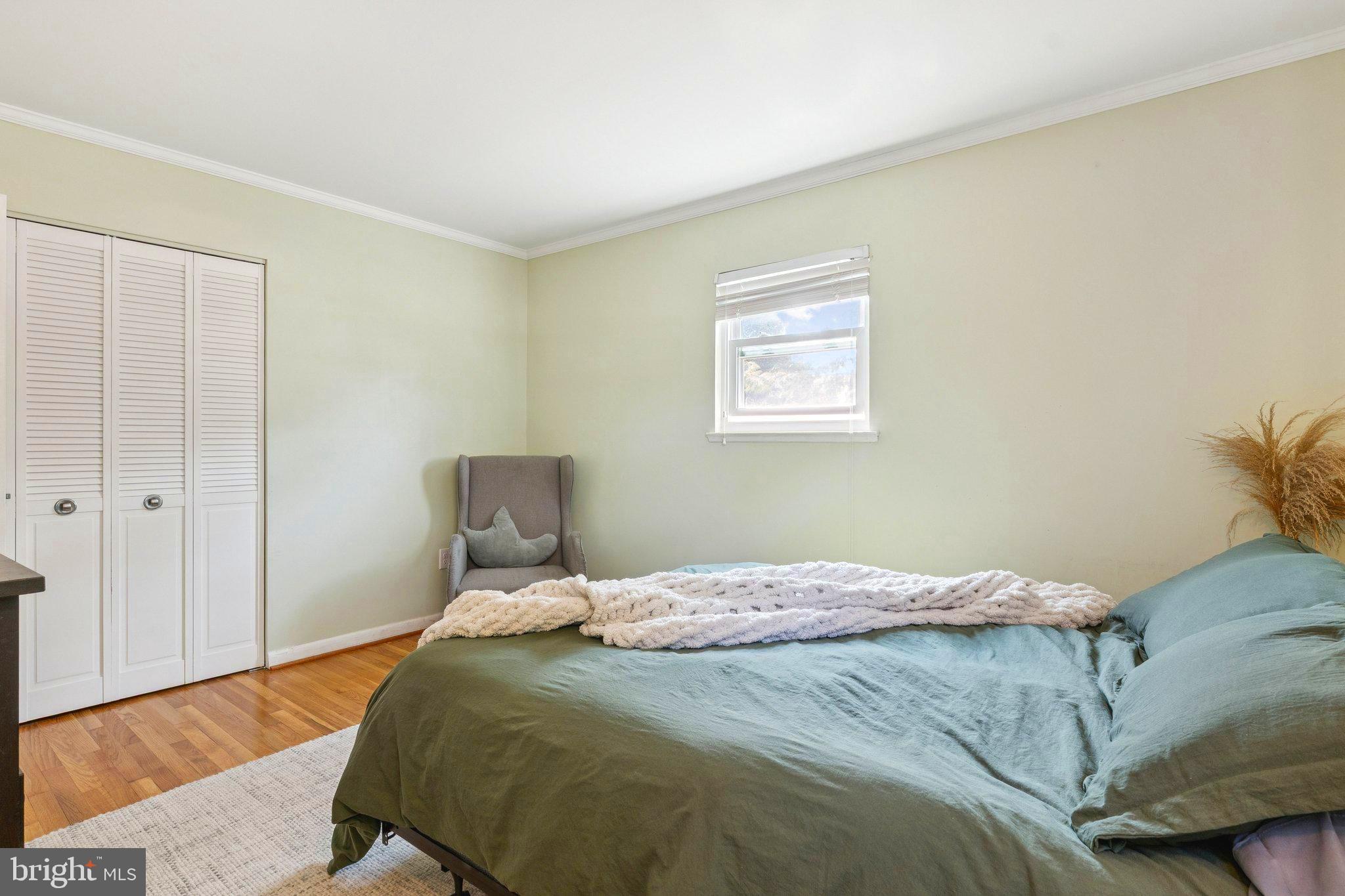 6200 Gilston Park Road Catonsville, MD 21228 - Photo 15 of 34 a bedroom with a bed and hallway