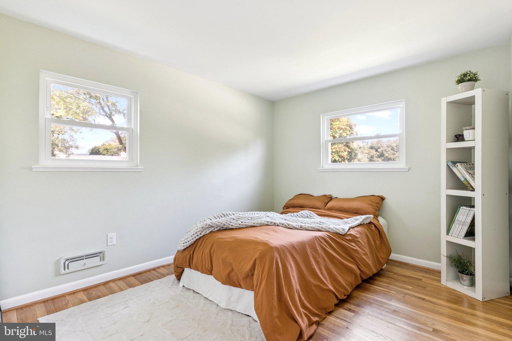 6200 Gilston Park Road Catonsville, MD 21228 - Photo 16 of 34 a bed sitting in a bedroom next to a window