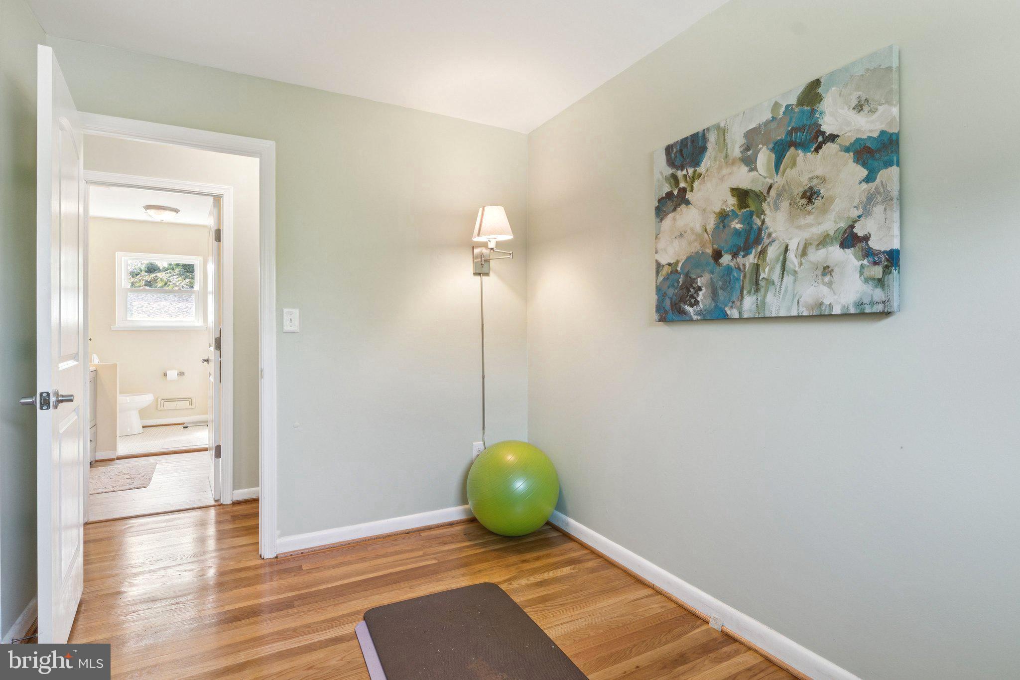 6200 Gilston Park Road Catonsville, MD 21228 - Photo 18 of 34 a view of a hallway with wooden floor and a cabinet