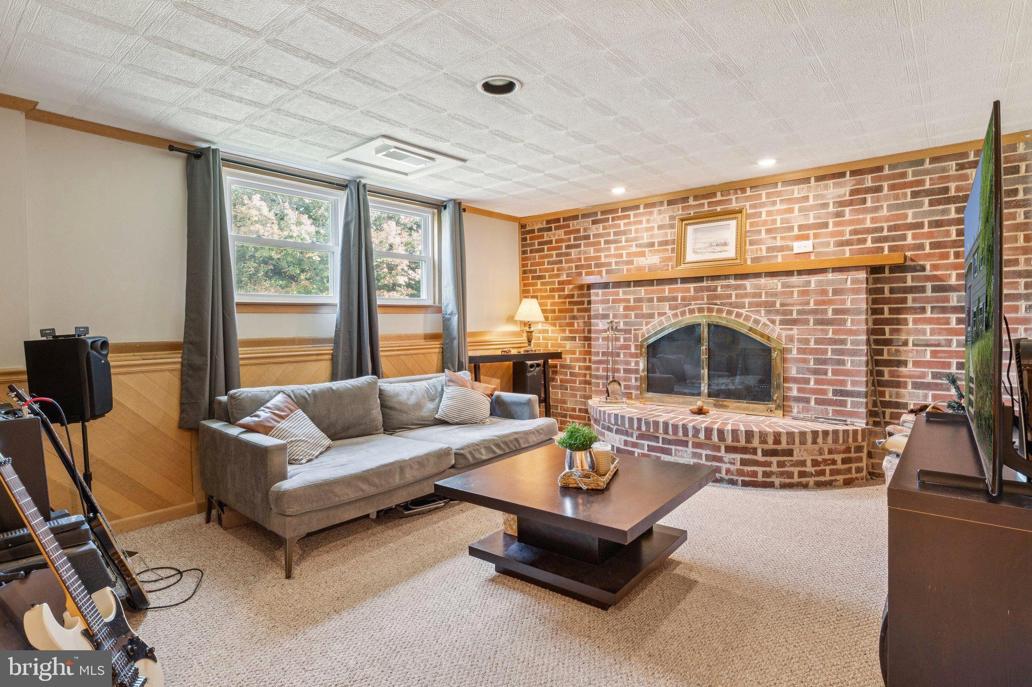 6200 Gilston Park Road Catonsville, MD 21228 - Photo 19 of 34 a living room with furniture and a fireplace