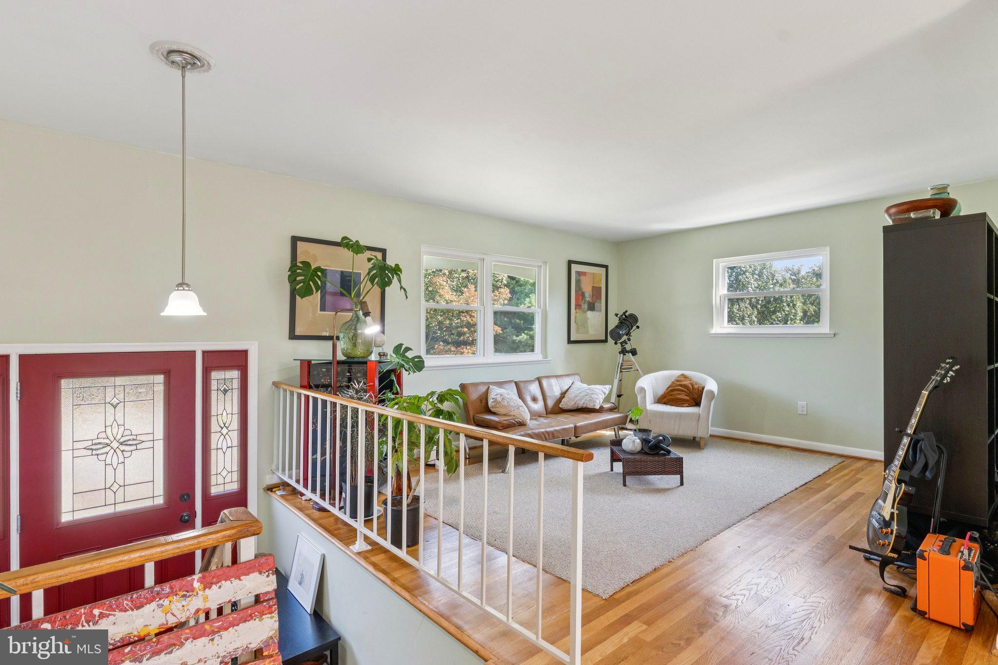6200 Gilston Park Road Catonsville, MD 21228 - Photo 3 of 34 a living room with furniture windows and a flat screen tv