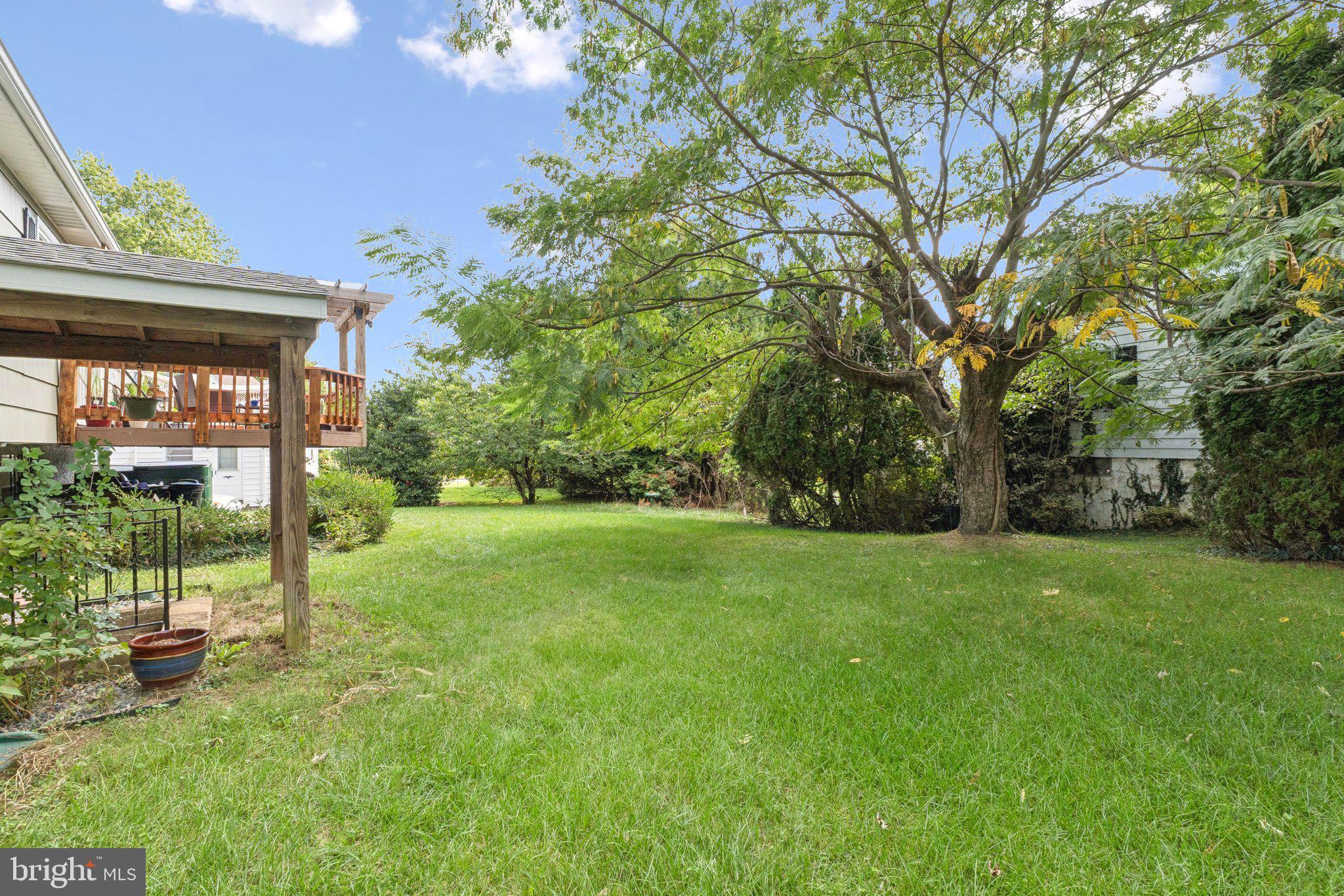 6200 Gilston Park Road Catonsville, MD 21228 - Photo 31 of 34 a view of a house with a backyard and a patio