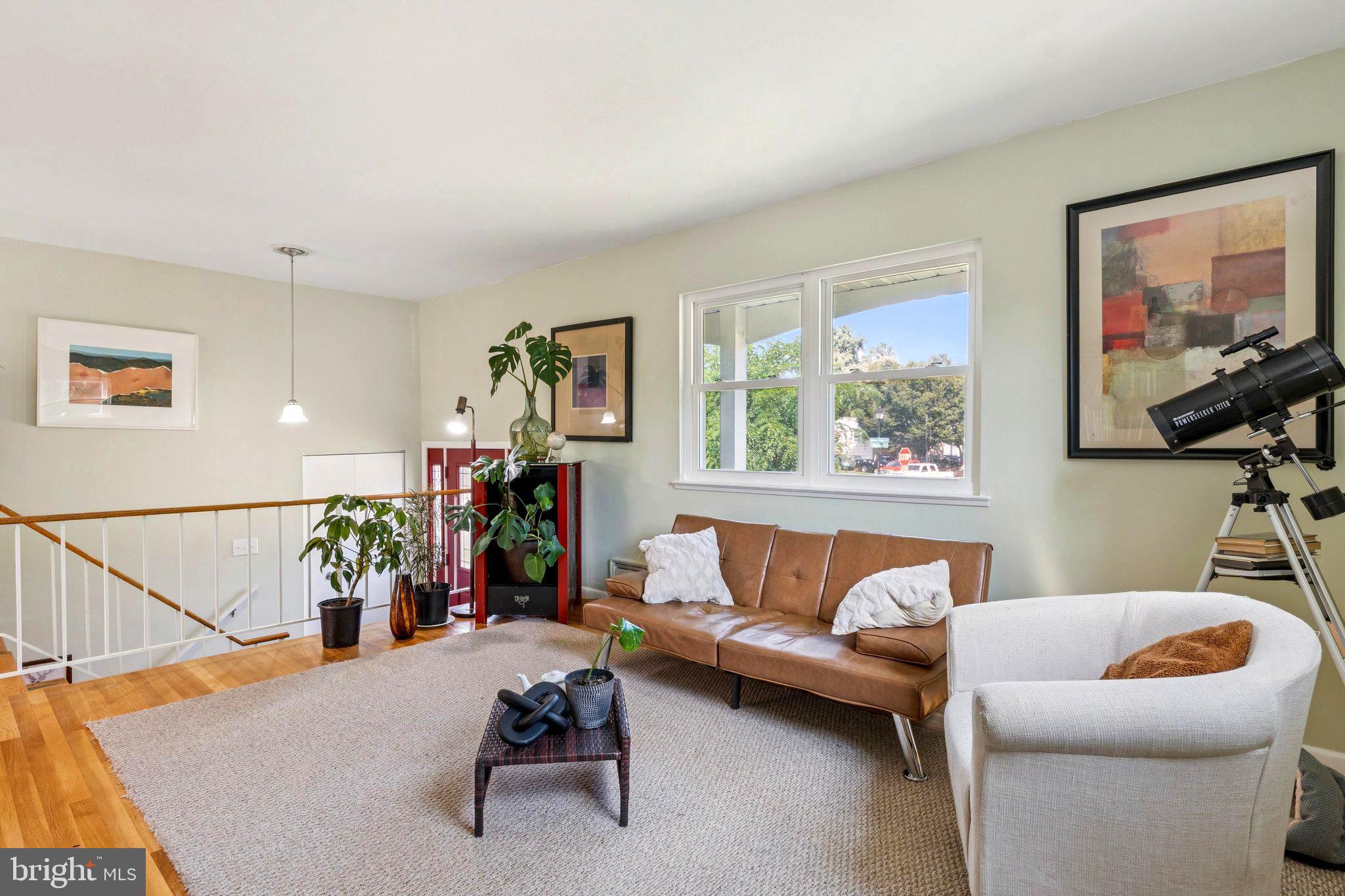6200 Gilston Park Road Catonsville, MD 21228 - Photo 4 of 34 a living room with furniture and a flat screen tv