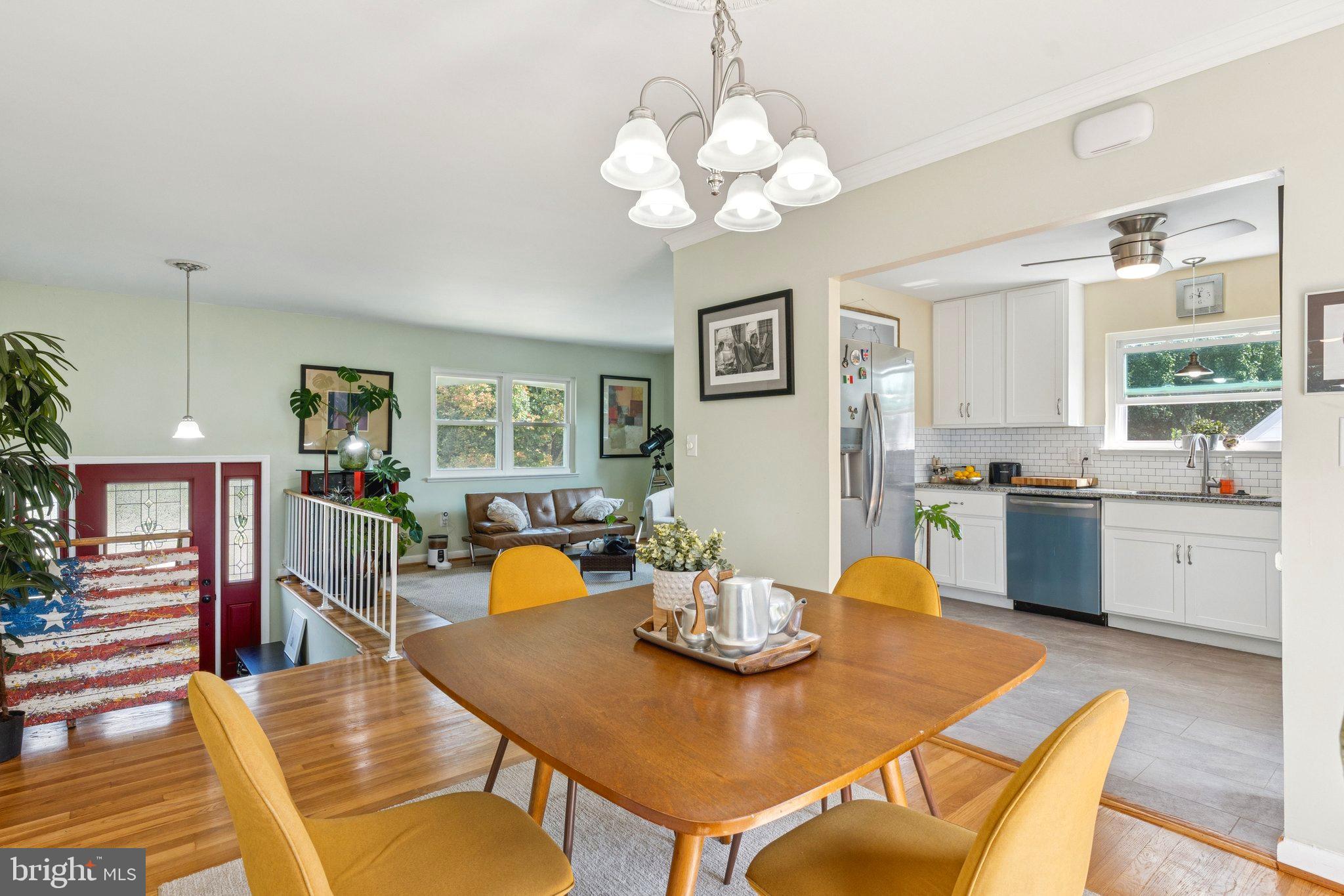6200 Gilston Park Road Catonsville, MD 21228 - Photo 6 of 34 a view of a dining room with furniture and wooden floor