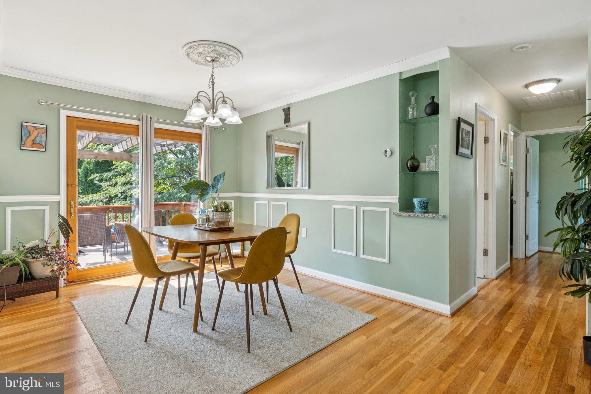 6200 Gilston Park Road Catonsville, MD 21228 - Photo 7 of 34 a view of a dining room with furniture window and wooden floor