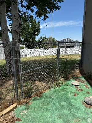 641 East Greystone Way Tooele, UT 84074 - Photo 24 of 30 Chain-link fencing defining the property boundary