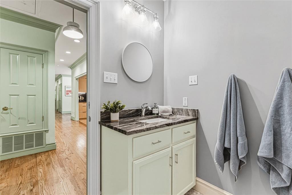 3201 Edward Drive Waco, TX 76708 - Photo 32 of 40 a bathroom with a granite countertop sink a mirror and a vanity