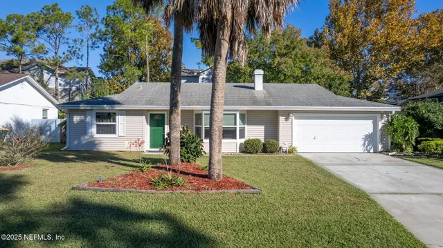 a front view of a house with a garden and porch